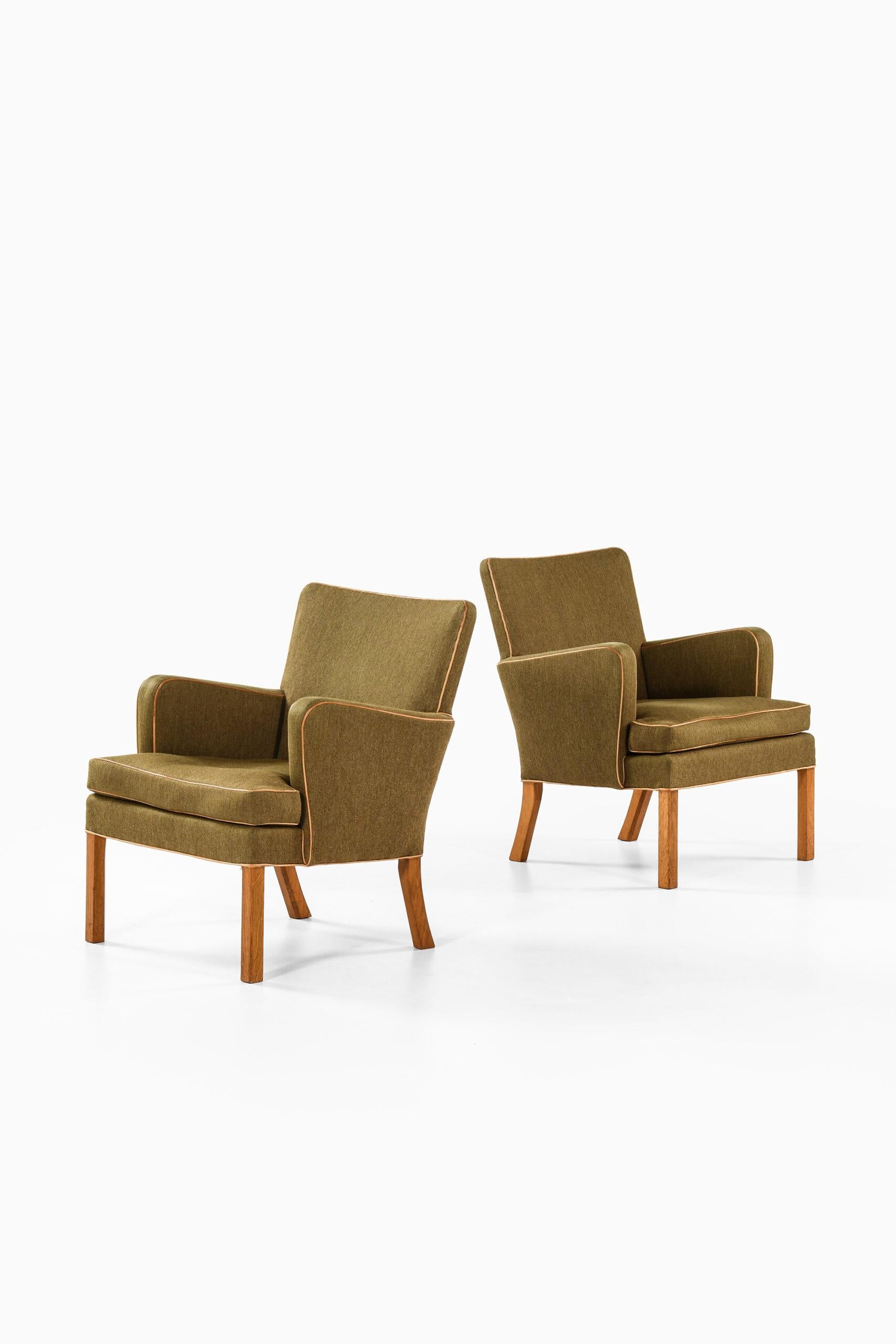 Rare pair of easy chairs model 5313 designed by Kaare Klint. Produced by cabinetmaker Rud Rasmussen in Denmark.