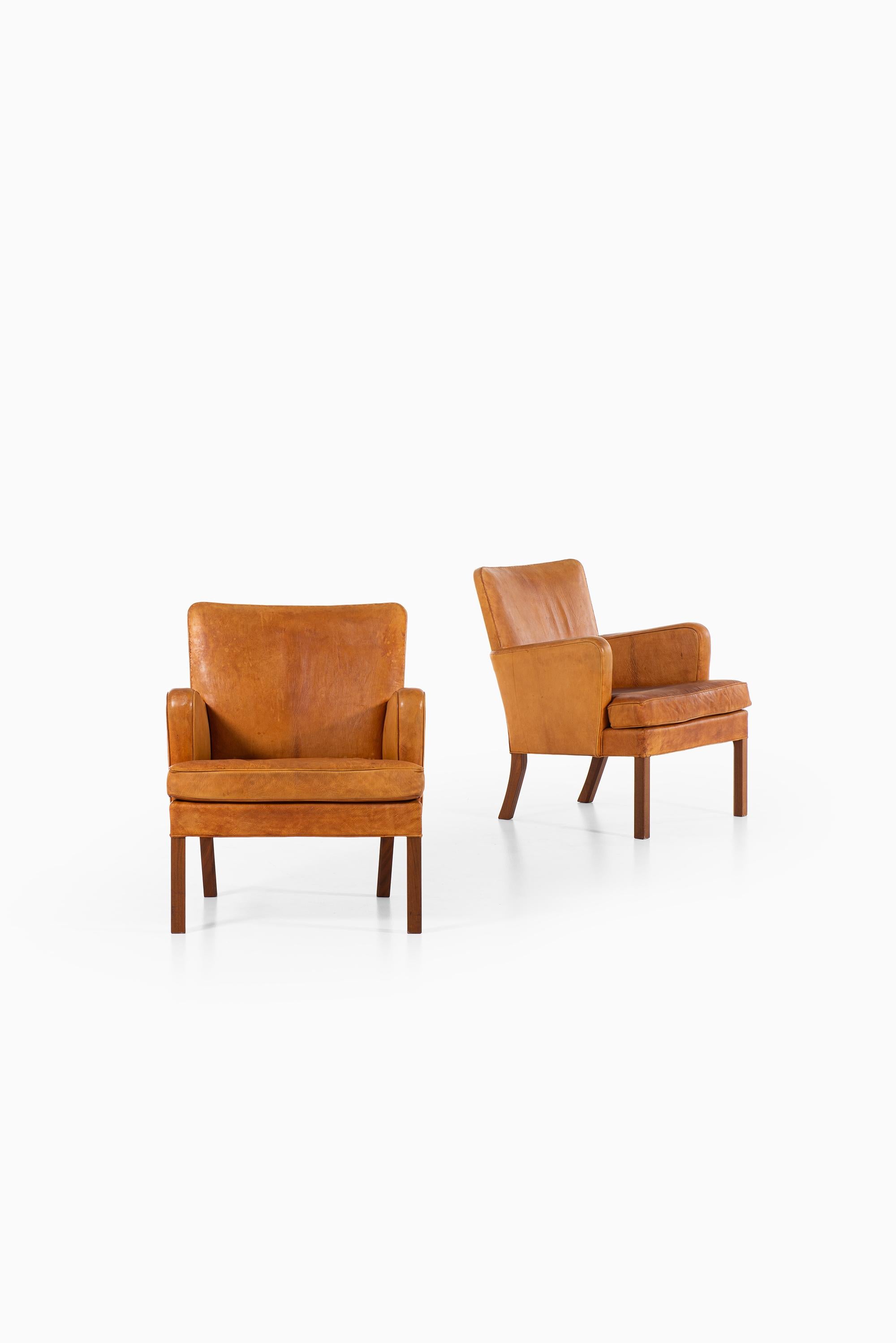 Rare pair of easy chairs model 5313 designed by Kaare Klint. Produced by Rud. Rasmussen Cabinetmakers in Denmark.