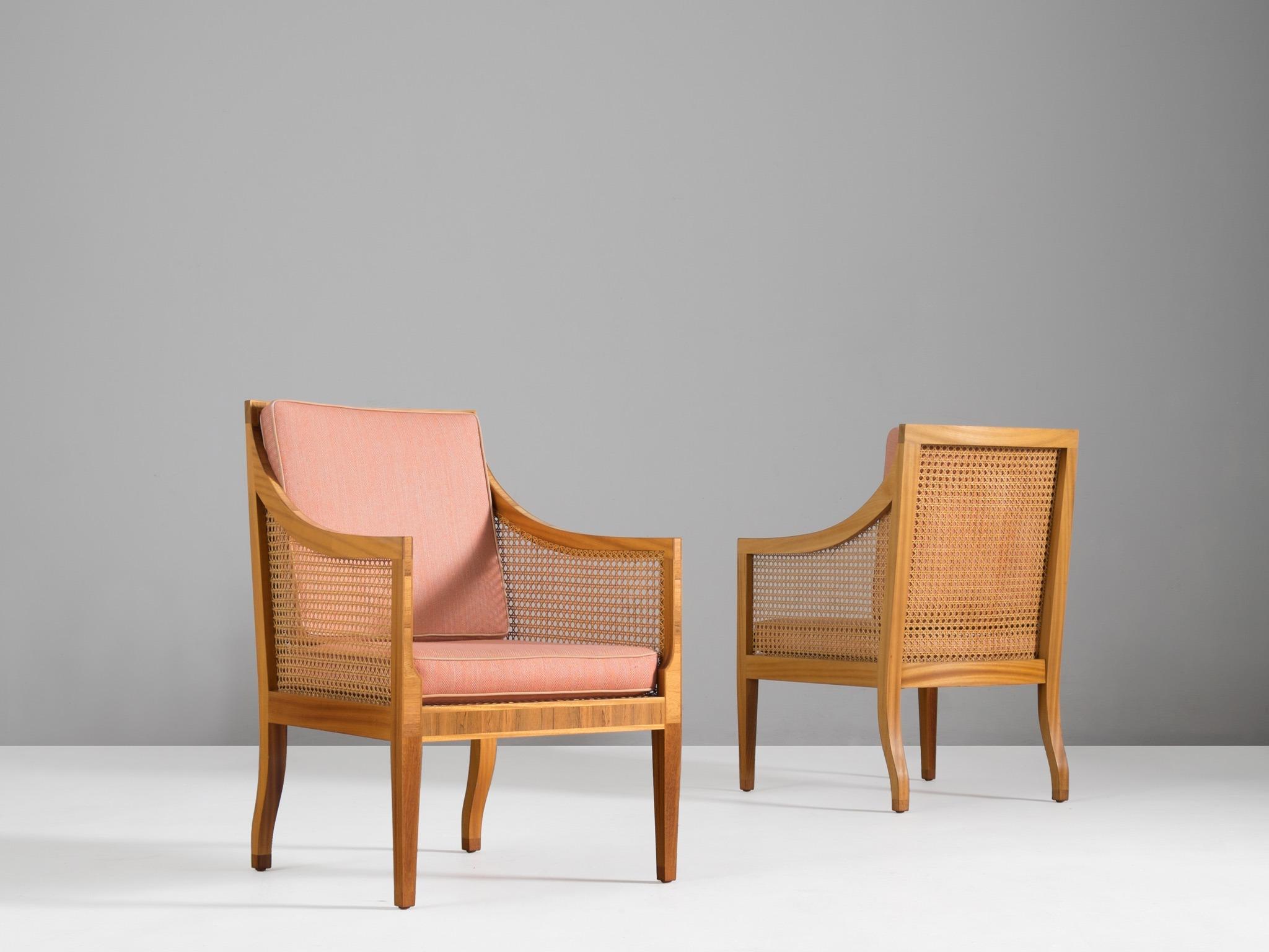 Kaare Klint for Rasmussen, set of two 4488 lounge chairs, mahogany, rosewood, cane and fabric, Denmark, design of 1931.

This elegant set of easy chairs are designed by Kaar Klint in 1931. This 4488 model, also named 