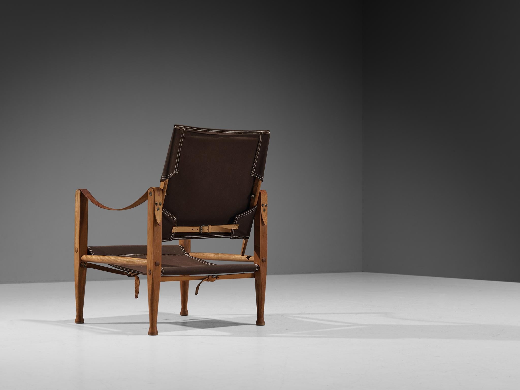 Kaare Klint for Rud Rasmussen, safari chair model 'KK47000', ash, canvas, metal, brass, leather, Denmark, designed in 1933 and produced in 1960s. 

The chair shows very elegant and well-designed lines, in combination with carefully crafted wood