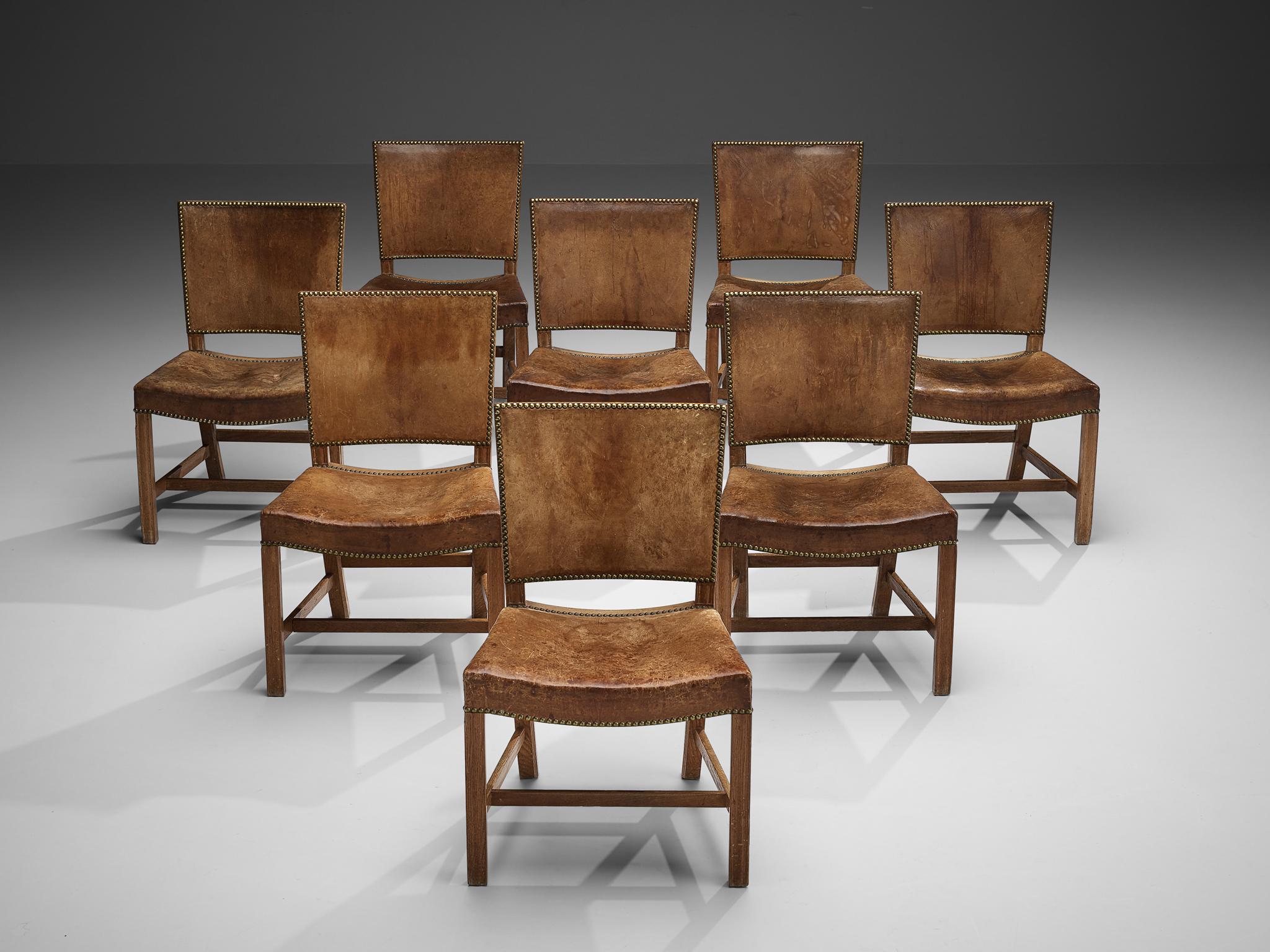 Kaare Klint for Rud Rasmussen, set of eight dining chairs 'The Red Chair', model 3758, oak, original patinated Niger leather, brass nails, designed 1927, manufactured 1930s

Set of eight dining chairs, designed by Kaare Klint in 1927 and