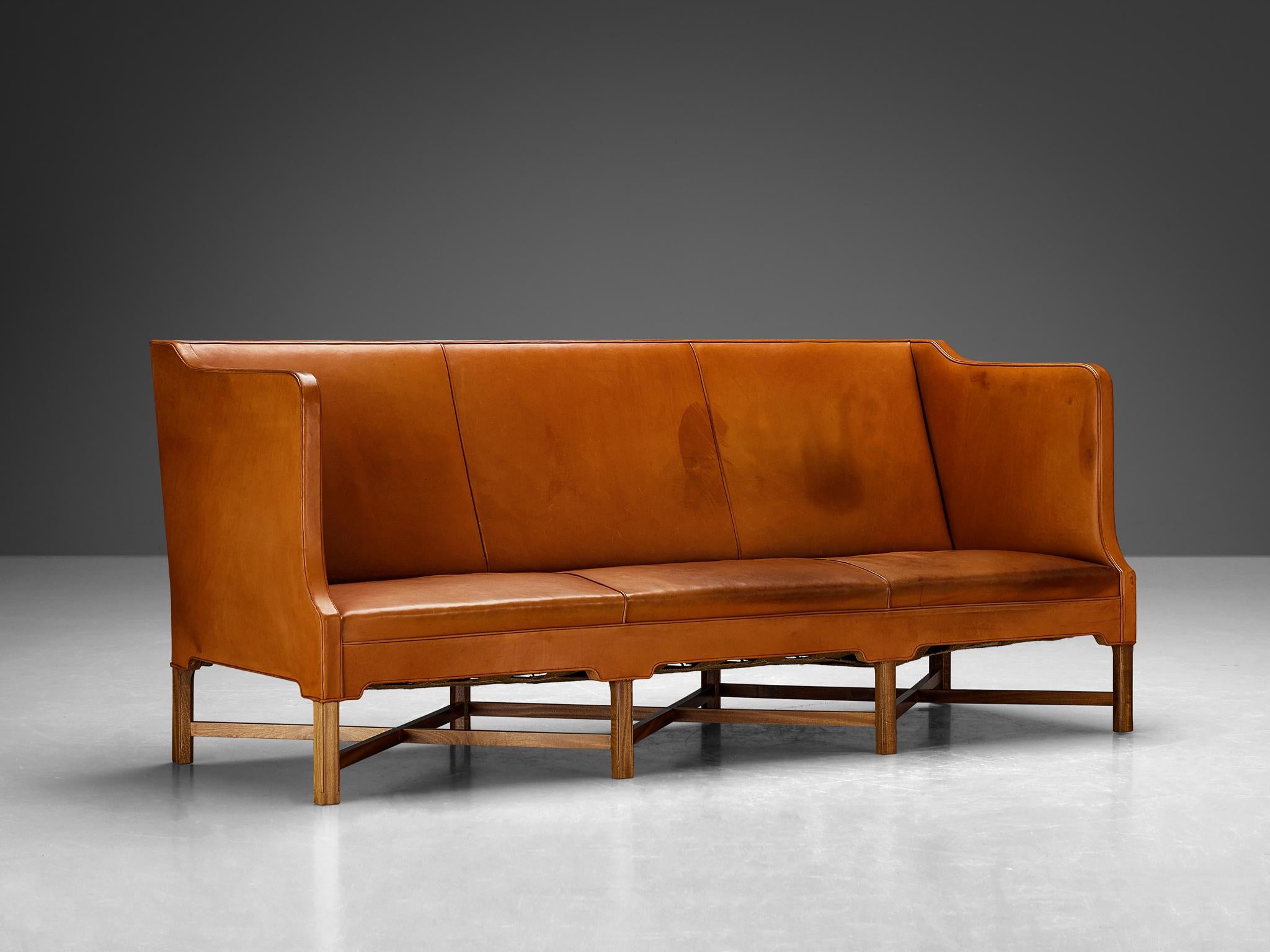 Kaare Klint for Rud.Rasmussen, sofa, model '4118', leather, mahogany, Denmark, design 1930, production 1981

Kaare Klint originally designed the present three-seat sofa, known as 4118, for the office of the Prime Minister Throvald Stauning
