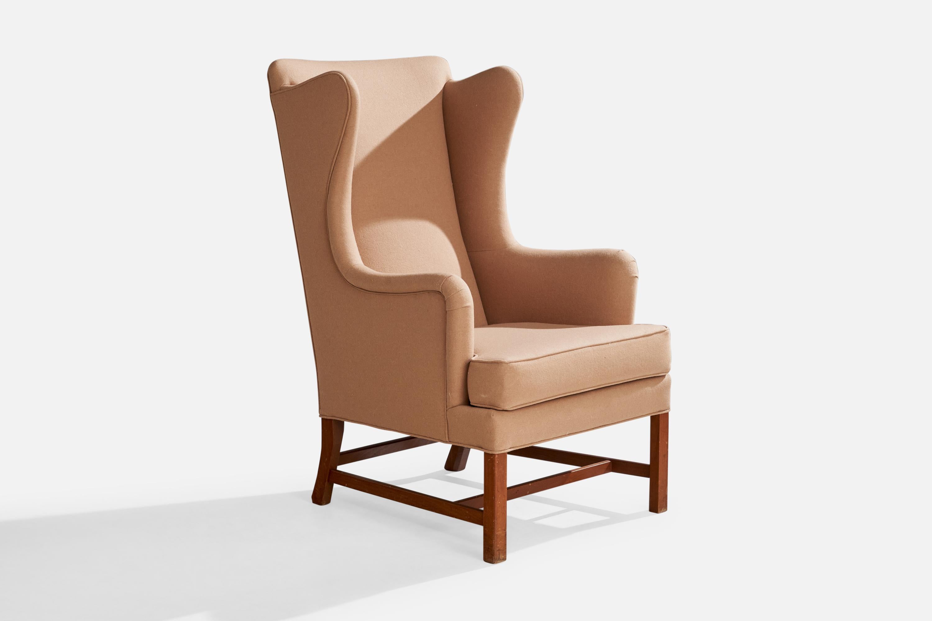 A light pink fabric and mahogany lounge chair designed by Kaare Klint in 1941 and produced by Rud. Rasmussen, Denmark, c. 1950s.

Dimensions: 45.7” H x 28” W x 37” D

Seat Height: 19.7”