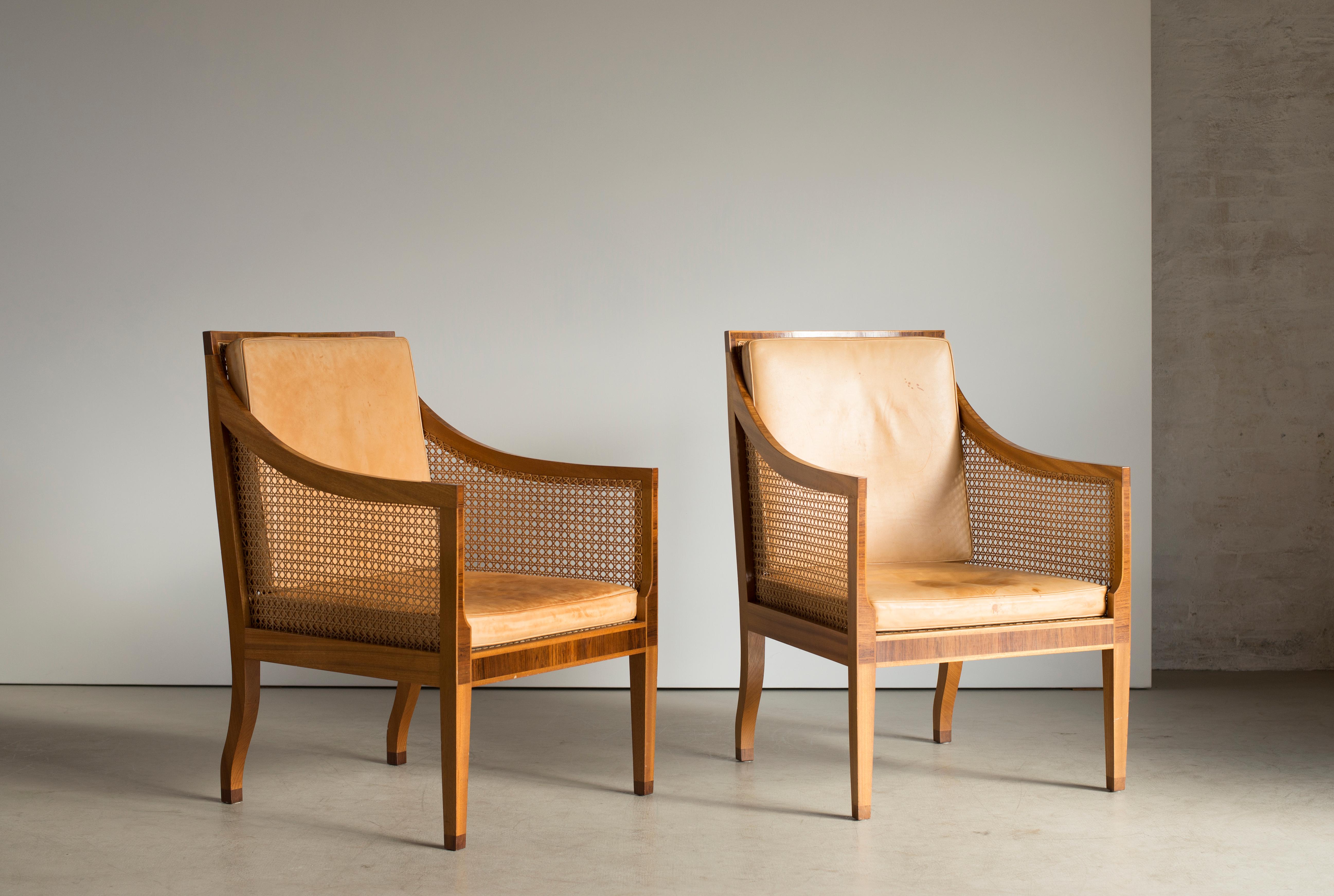Kaare Klint Pair of Bergere chairs in Mahogany. Executed by Rud. Rasmussen.

Reverse with paper labels ‘RUD. RASMUSSENS/SNEDKERIER/KØBENHAVN/DENMARK.