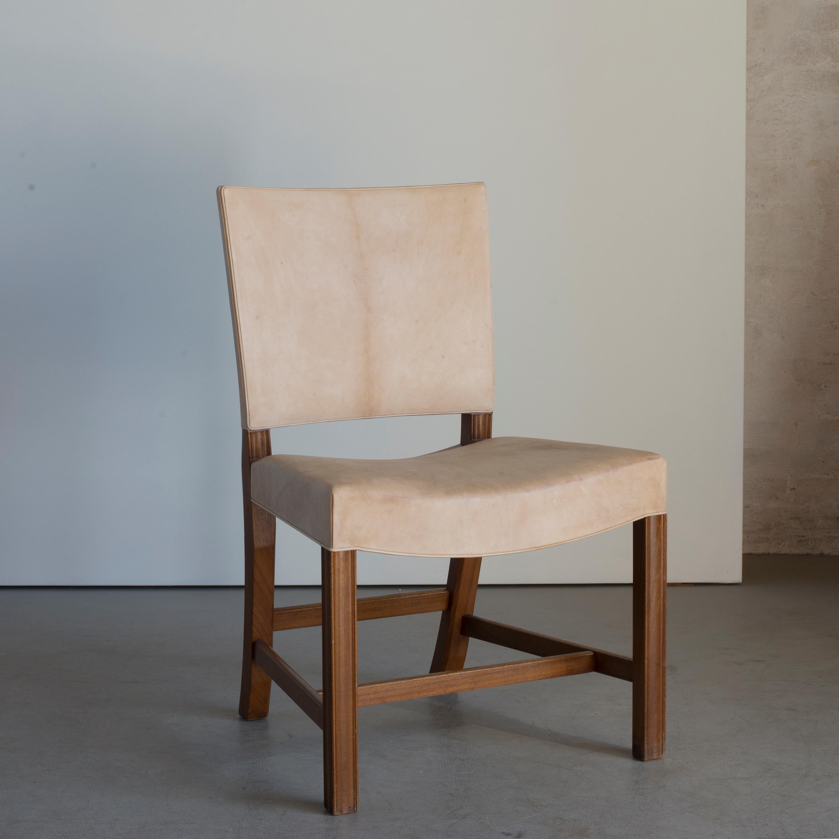 Kaare Klint 'Red Chair' of mahogany and Niger leather. Executed by Rud. Rasmussen.

Underside with manufacturer's paper label RUD. RASMUSSENS/SNEDKERIER/45 NØRREBROGAD/KØBENHAVN, penciled number and architect's monogrammed paper label.
