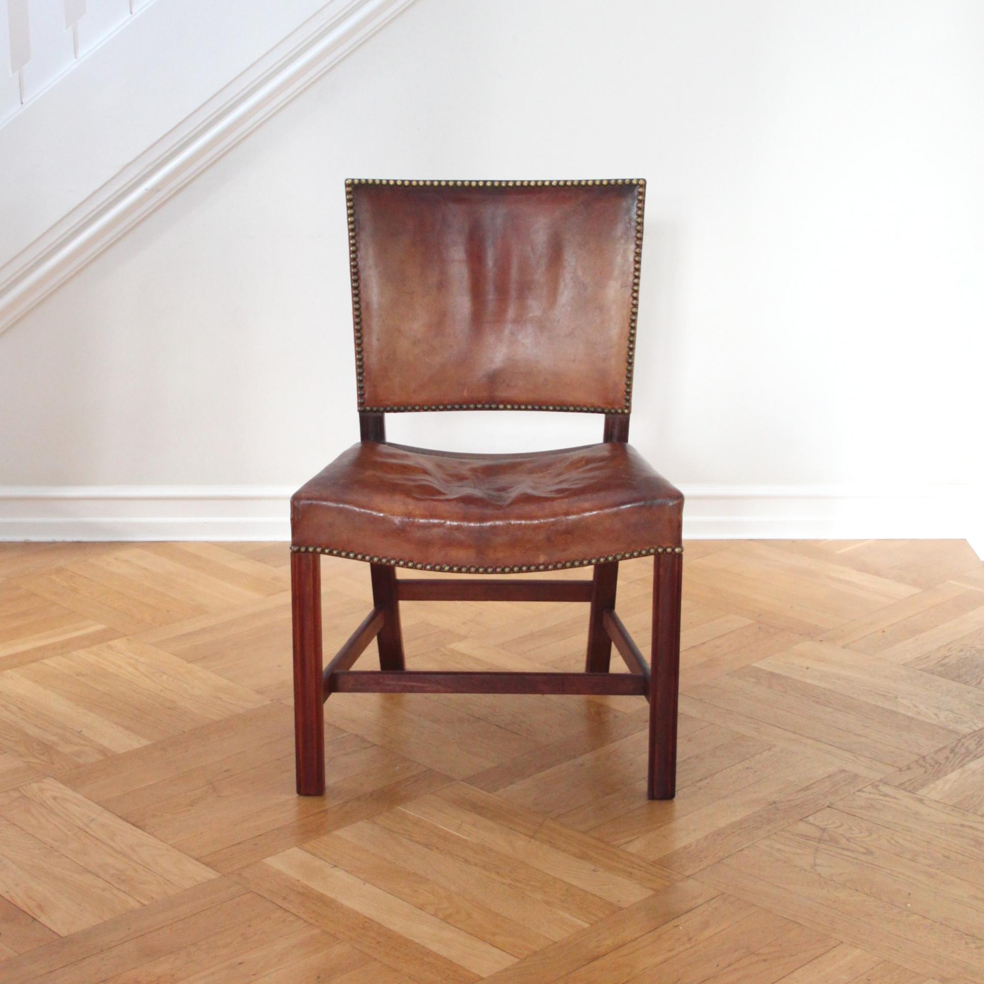 Kaare Klint & Rud Rasmussen - Scandinavian Modern

A beautiful Kaare Klint 'Red Chair' or 'Barcelona Chair' by Kaare Klint with deep patina in original Niger leather, profiled legs of mahogany and brass nails.

These examples made circa 1930s by