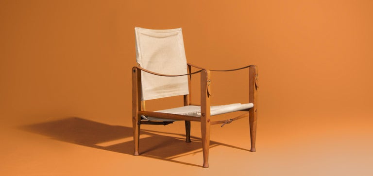 Safari chair was designed by Kaare Klint in the 1930s. This safari chair is produced by Rud Rasmussen in Denmark. This is the first design where no tools are needed to assemble and disassemble the chairs. The frames are made of oak wood. The seats
