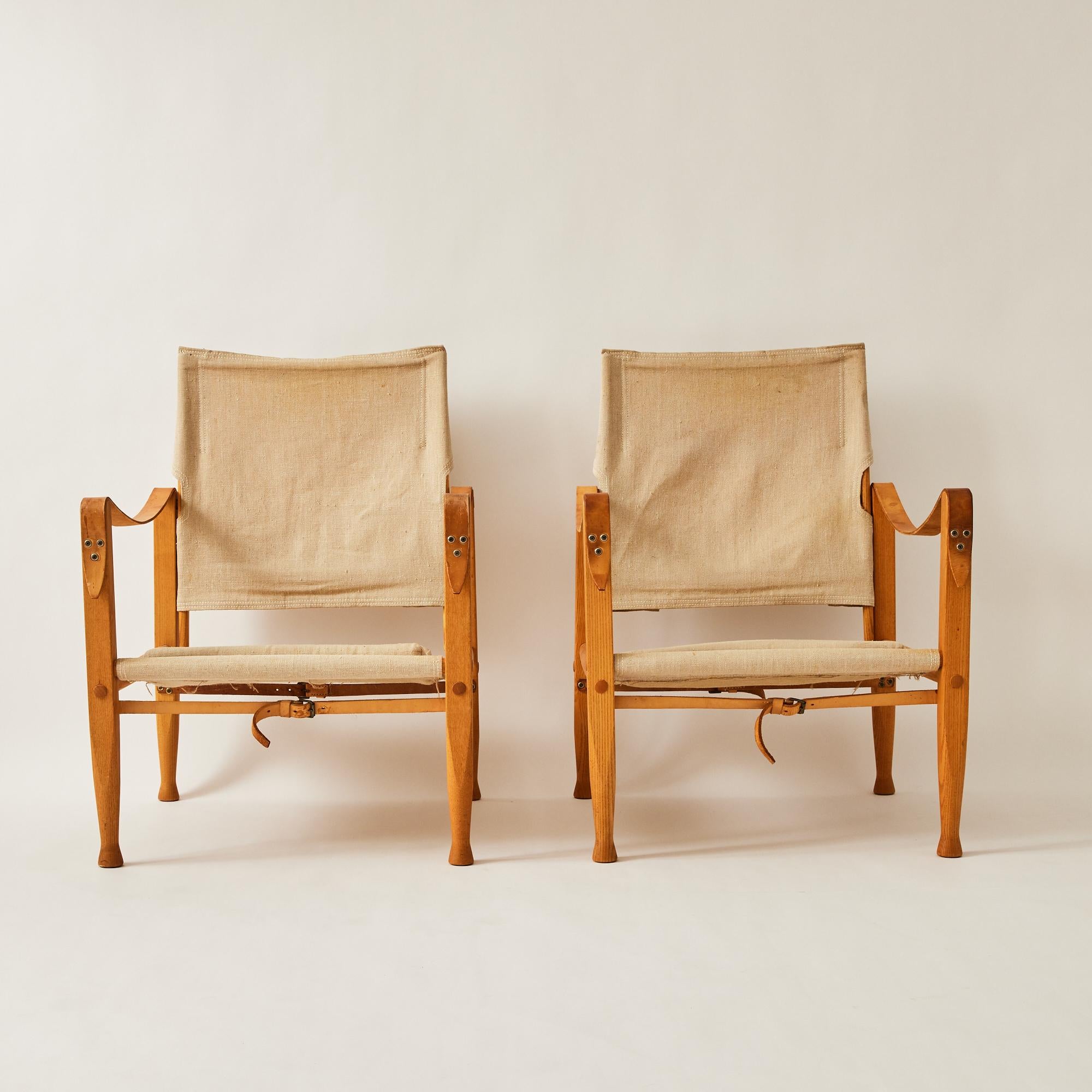 Iconic Danish Safari chairs designed by designer Kaare Klint who is known as the father of Danish modernism. They were designed in the 1930s and manufactured by Rud Rasmussen in the 1960's. Klint was inspired by images of the Roorkhee chair which