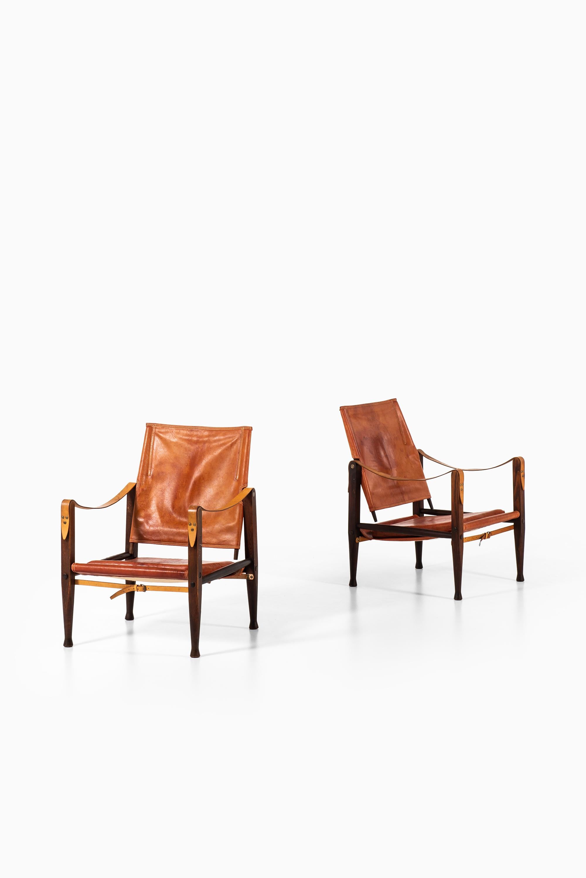 Rare pair of safari easy chairs designed by Kaare Klint. Produced by Rud Rasmussen in Denmark.