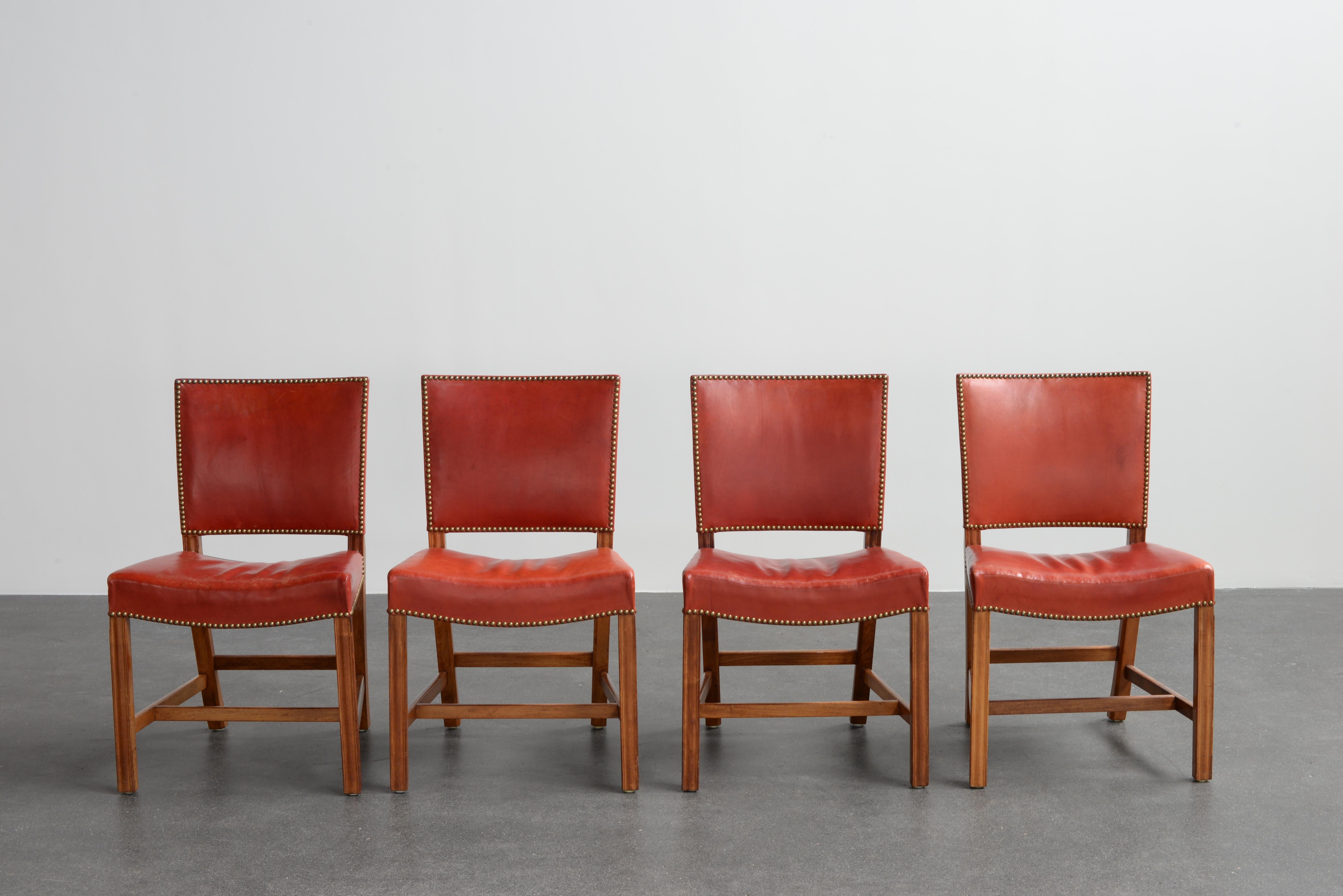 Kaare Klint set of for Red chairs in mahogany, leather and brass. Executed by Rud. Rasmussen.