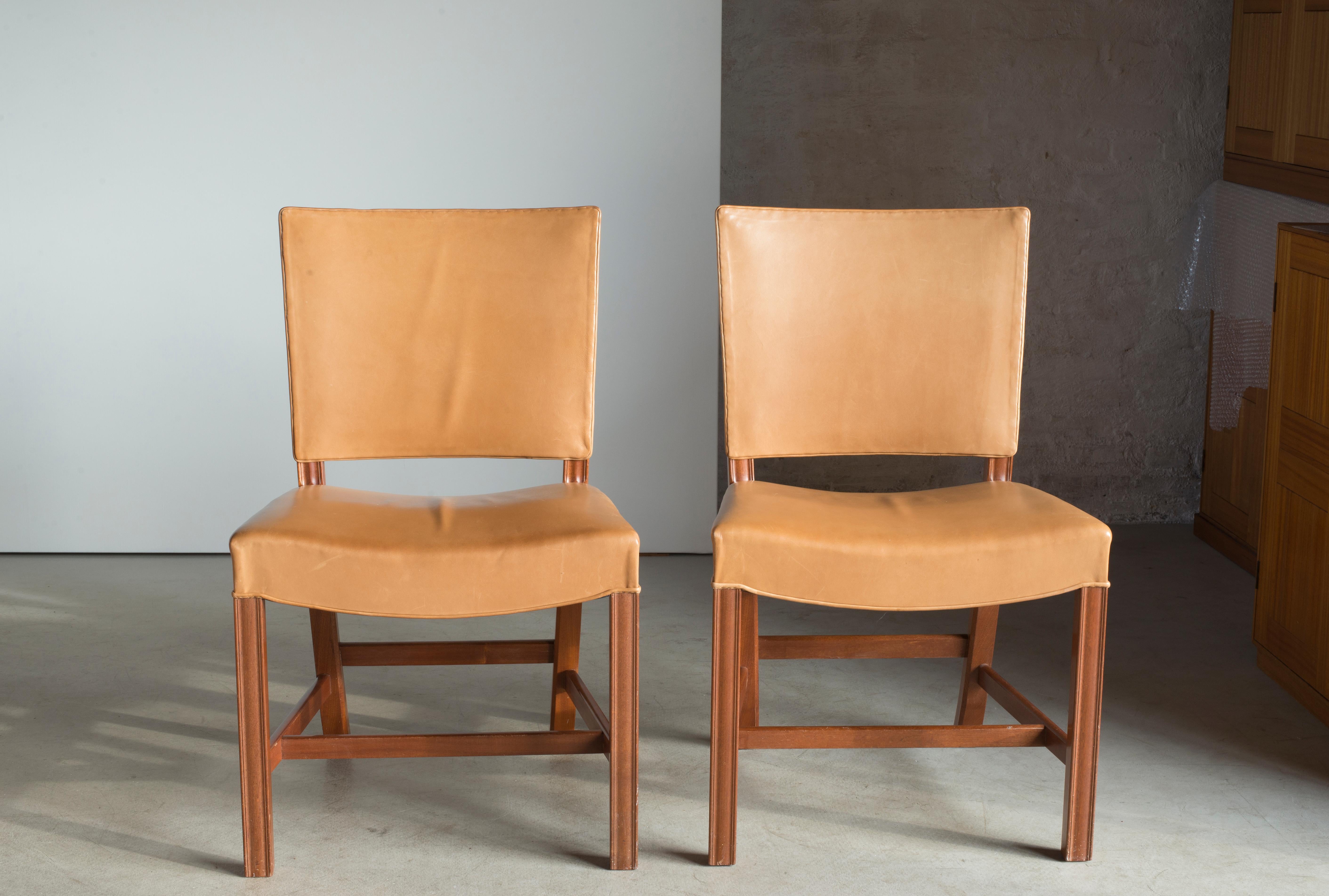 Kaare Klint set of four red chairs in mahogany and leather. Executed by Rud. Rasmussen.