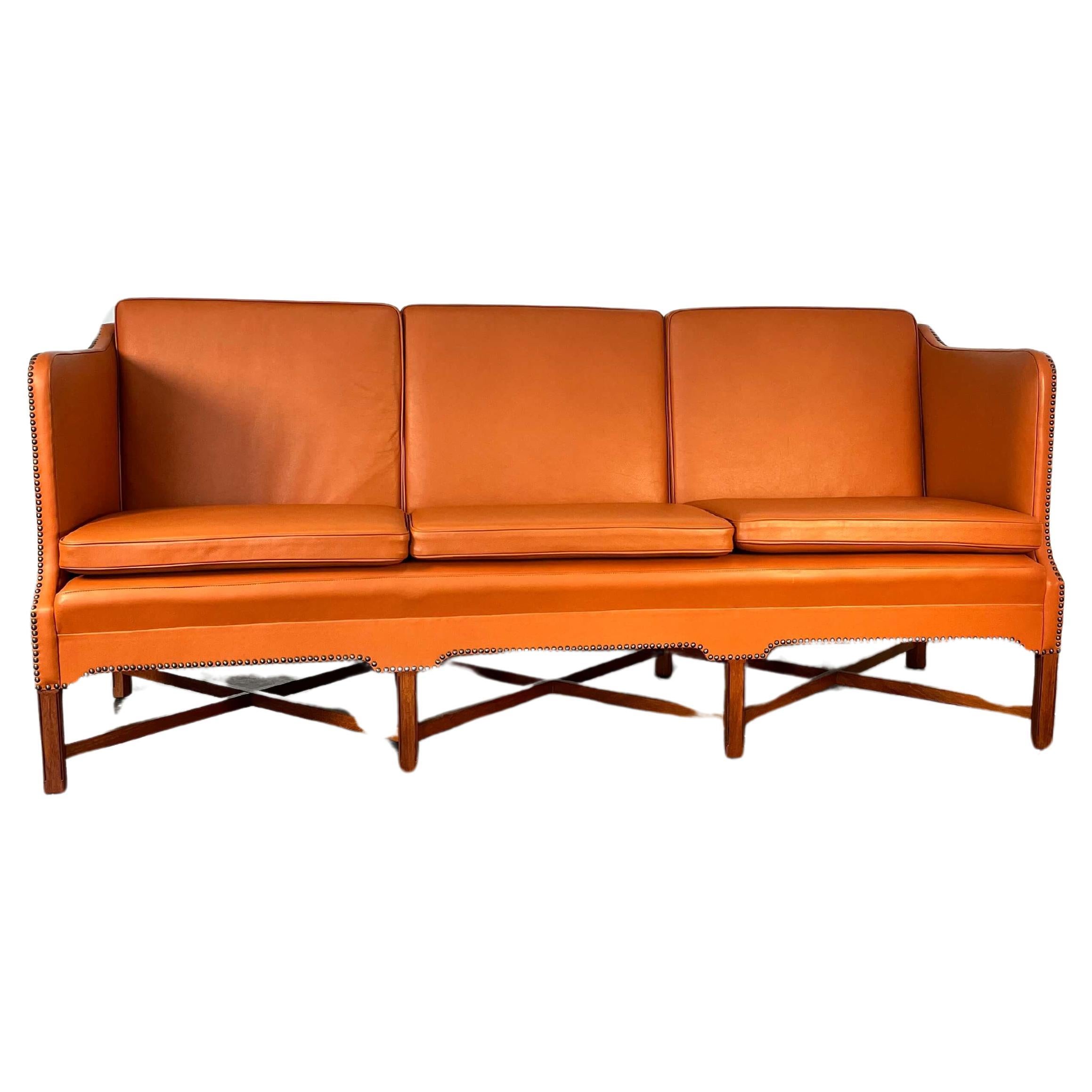 Kaare Klint for Rud.Rasmussen, sofa #4118, made with leather and mahogany, Denmark. Designed in 1930's, we cant pinpoint the exact production date of this sofa.

Kaare Klint originally designed the present three-seat sofa, known as 4118, for the