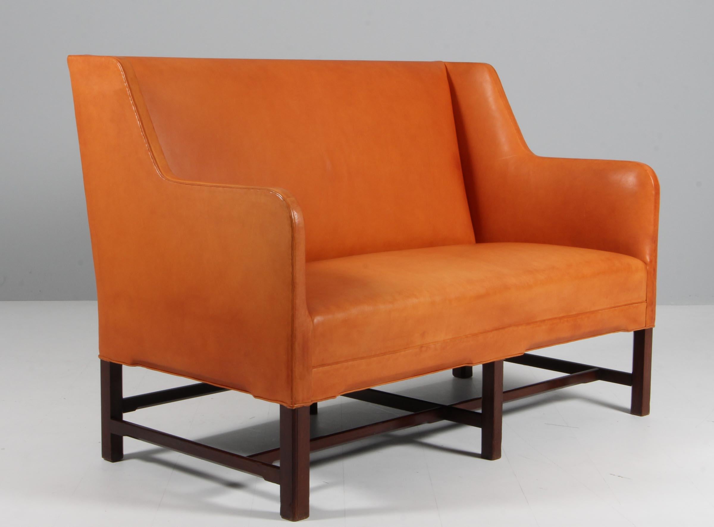 Very rare sofa model no 5011 designed by Kaare Klint. Produced by Rud. Rasmussen in Denmark. Original upholstered with patinated Niger leather.

