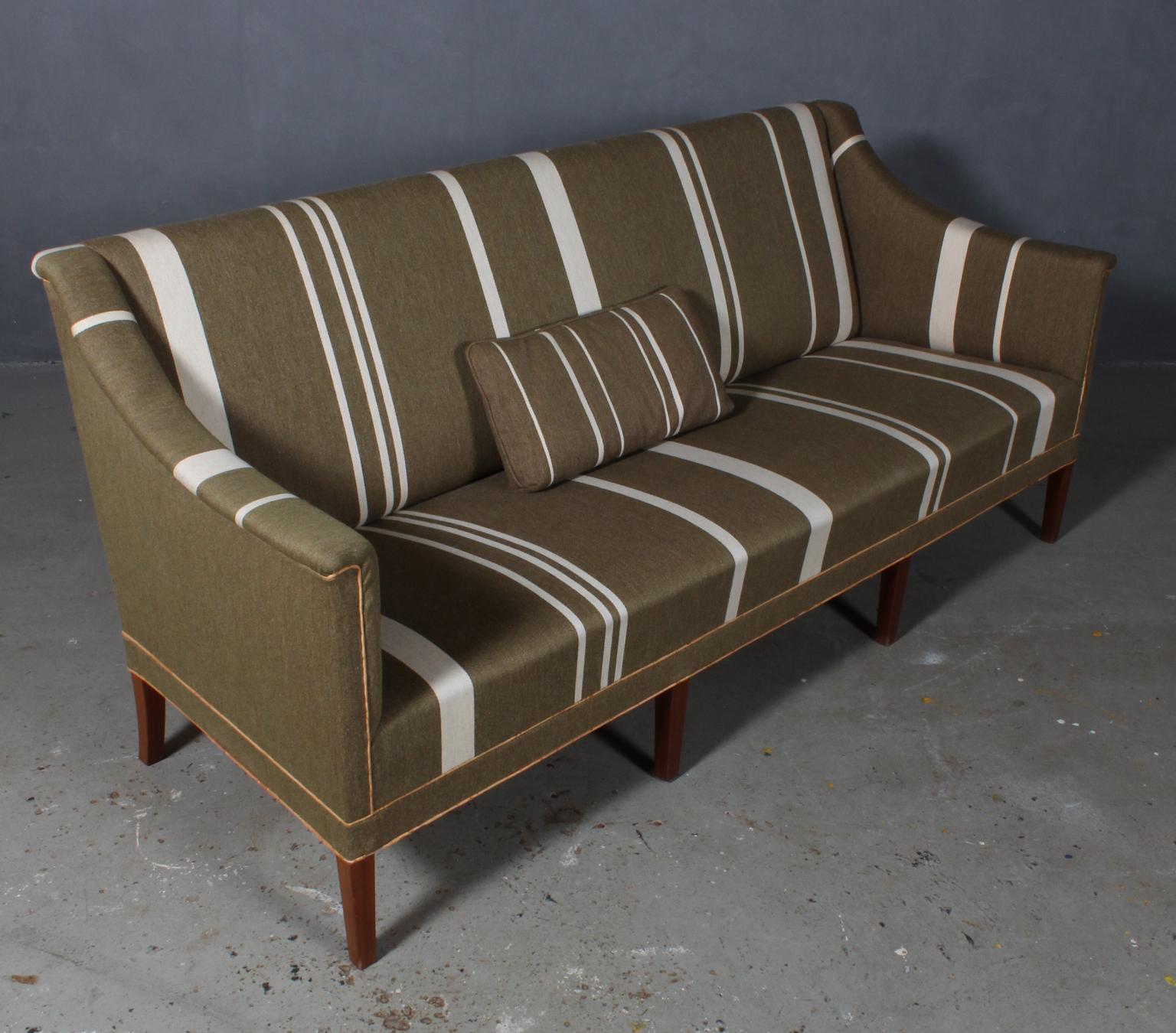 Kaare Klint sofa in green wool with white stripes. 

Legs of mahogany.

Made by Rud Rasmussen, model 6092.