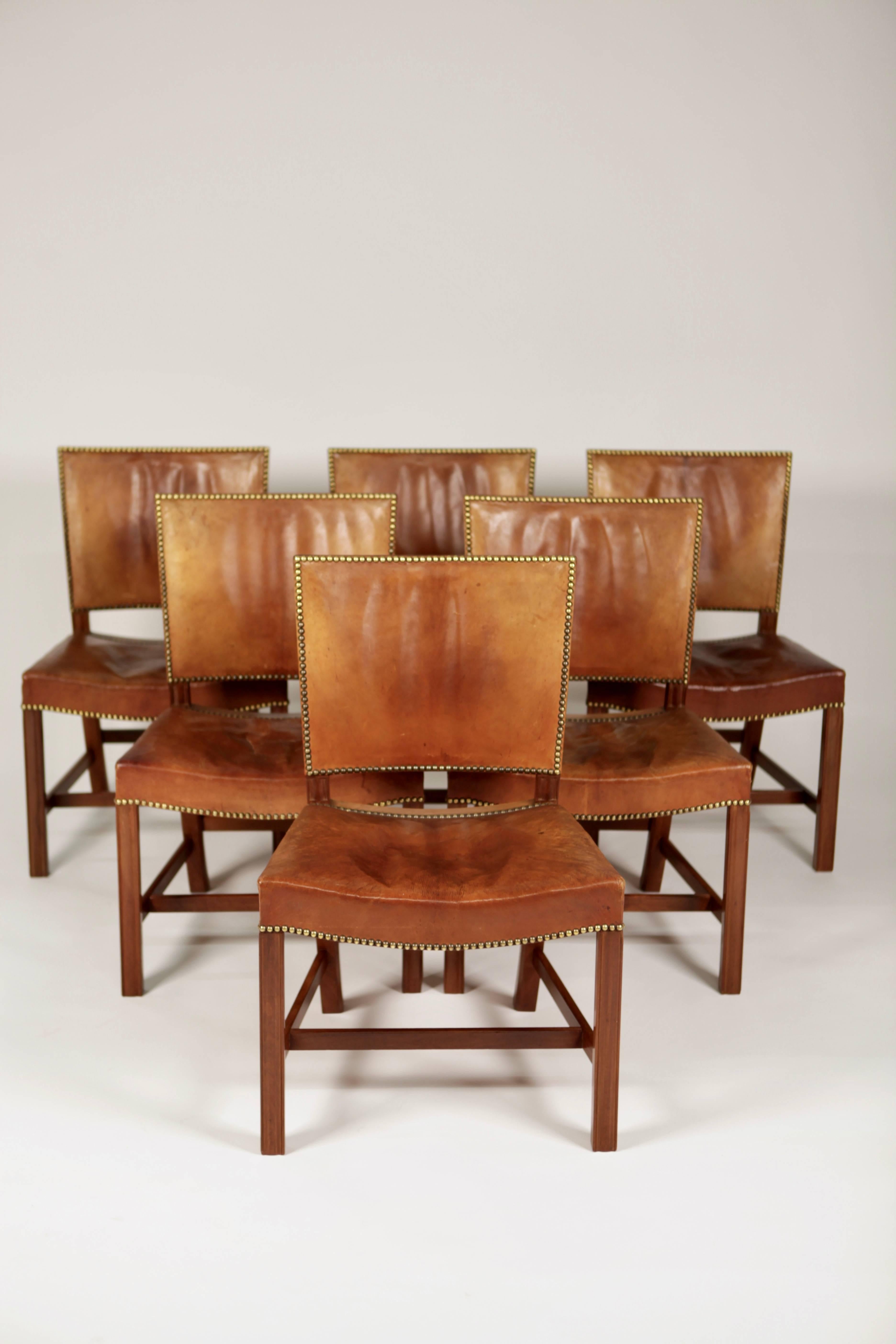 Kaare Klint,
A set of six 'Barcelona' dining chairs. Designed 1927
This set is manufactured 1932, in original, excellent condition, made of Cuban mahogany, Niger leather and brass nails.
Model 3758.
Executed by cabinetmakers Rud. Rasmussen A/S,