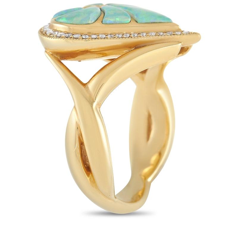 This heart-shaped ring from Kabana is poised to continually take your breath away. At the center, radiant inlaid opal stones add color and dimension. Surrounding diamonds totaling 0.21 carats also ensure this piece always makes a statement. Made