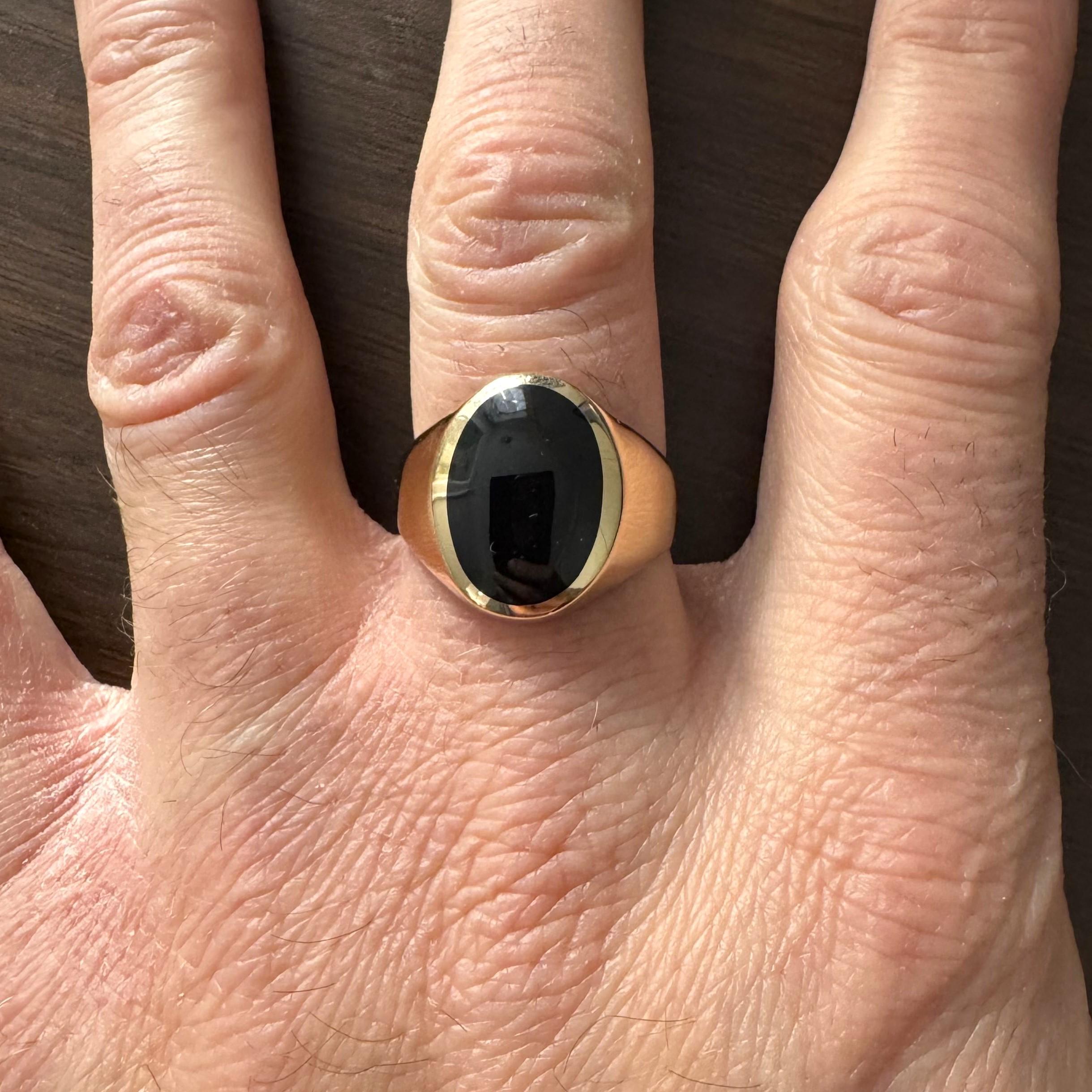 Condition:  Excellent Condition, Professionally Cleaned and Polished
Metal:  14k Gold (Marked, and Professionally Tested)
Weight:  14.4g
Gemstone:  In-Lay Set Oval Cut Black Onyx 17mm by 12mm
Band Width:  3.25mm
Size:  12.5
Markings:  
