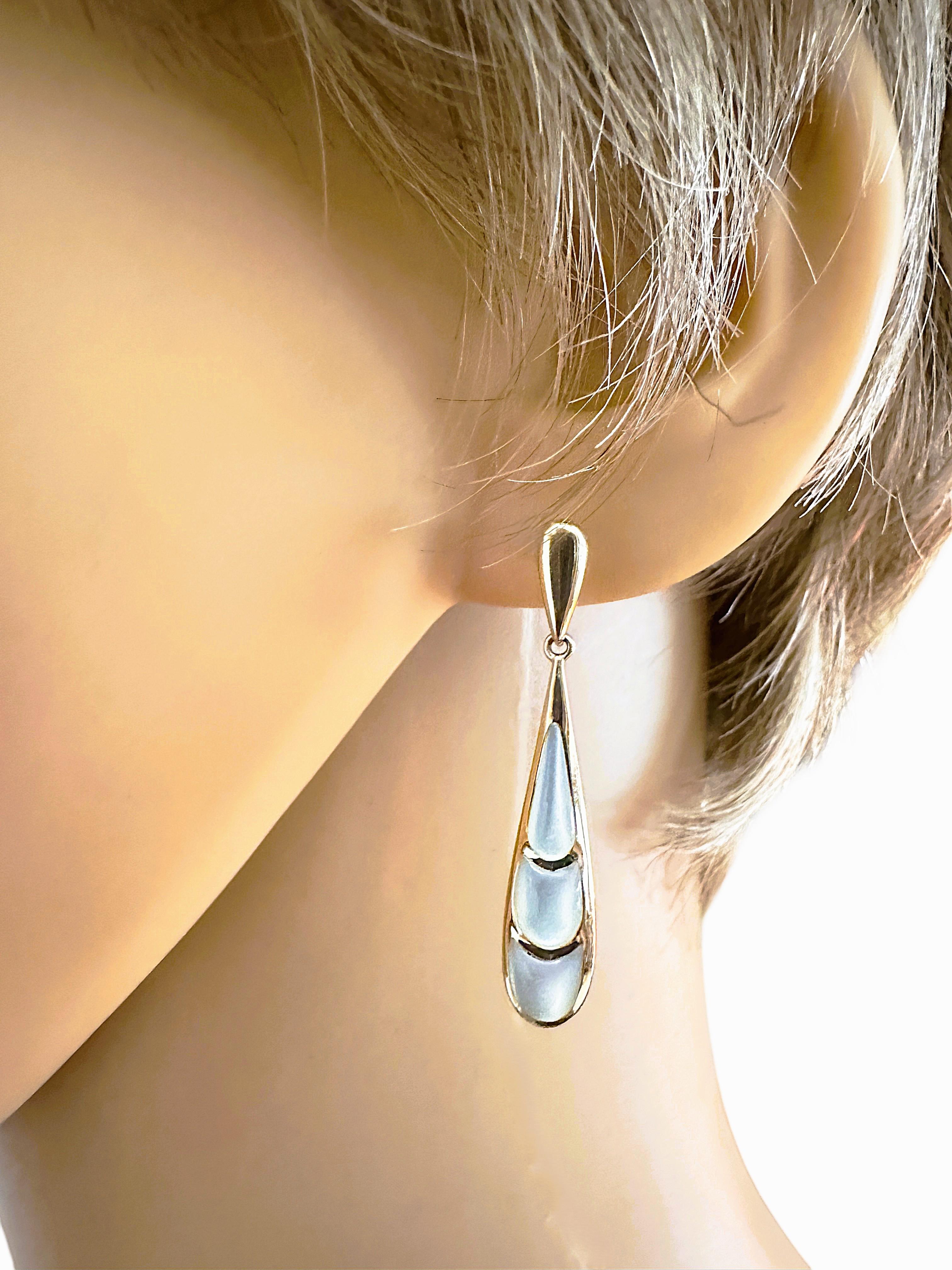 What a gorgeous pair of earrings.  Everything in the Kabana line is extraordinary!  They are Post, Dangle earrings and have 3 rungs of gorgeous Mother of Pearl gemstones surrounded by 14k Yellow Gold.  They are 1.5 inches long and .32 inches wide at