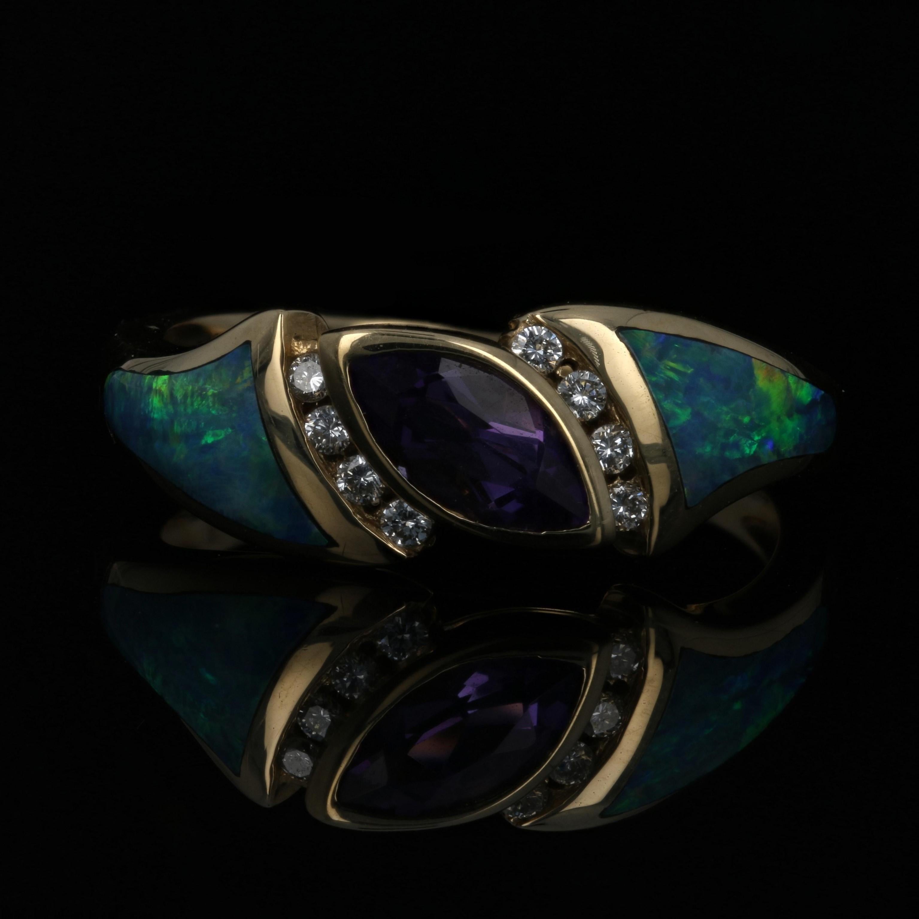 Surprise a special friend or family member with this gorgeous designer ring! Fashioned by Kabana in 14k yellow gold, this chic NEW piece features a diagonally-set amethyst bordered in diamond accents. Inlaid opals adorn the sides of the band as they