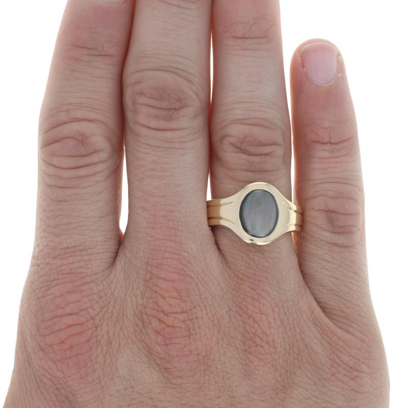 Size: 10 1/2

Metal Content: 14k Yellow Gold

Stone Information: 
Genuine Mother of Pearl
Color: Black
Size: 11.6mm x 9.6mm 

Face Height (north to south): 5/8