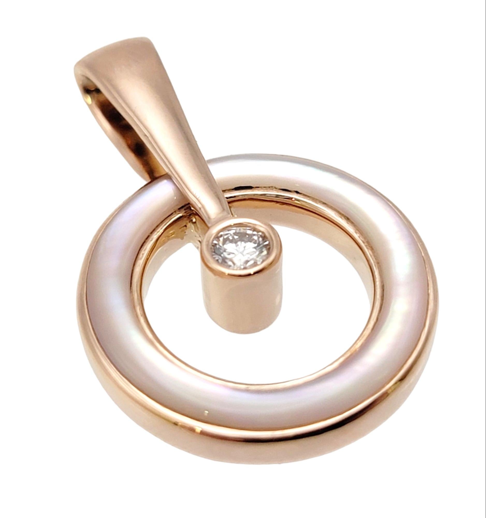 Captivating and contemporary mother of pearl and diamond circle pendant by jewelry designer, Kababa. This exquisite piece showcases the perfect fusion of artistry and elegance, destined to captivate hearts and spark admiration.

The pretty pendant