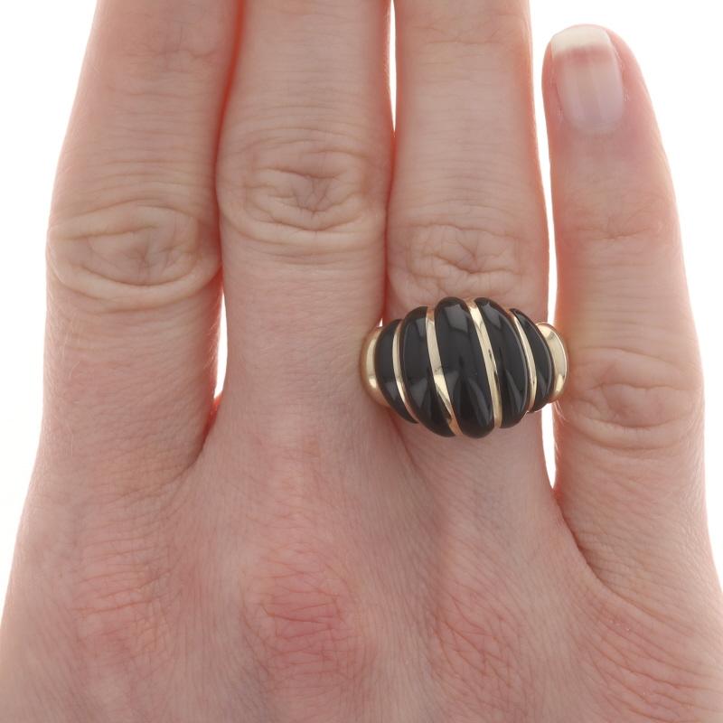 Size: 8

Brand: Kabana

Metal Content: 14k Yellow Gold

Stone Information

Natural Onyx
Cut: Inlay
Color: Black

Style: Cocktail Dome Band
Theme: Ribbed Shell

Measurements

Face Height (north to south): 19/32
