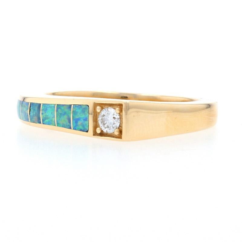 Give your wardrobe a touch of designer glamour with this gorgeous ring! Fashioned by Kabana in 14k yellow gold, this chic NEW piece features a modernist face accentuated with a bead-set diamond. Inlaid opals adorn the face and one side of the angled