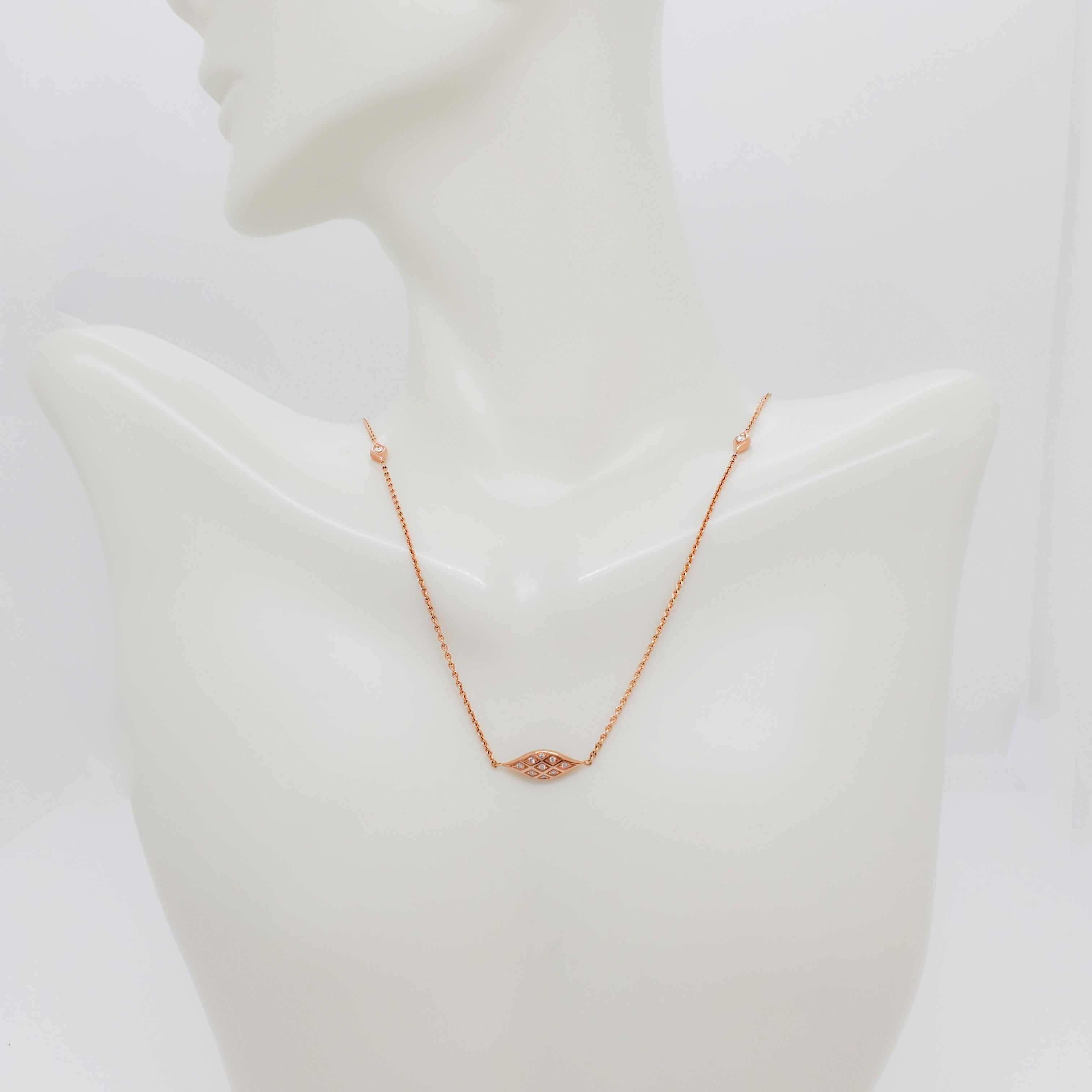 Beautiful Kabana necklace with pink mother of pearl and 0.11 ct. white diamond rounds. Handmade in 14k rose gold.