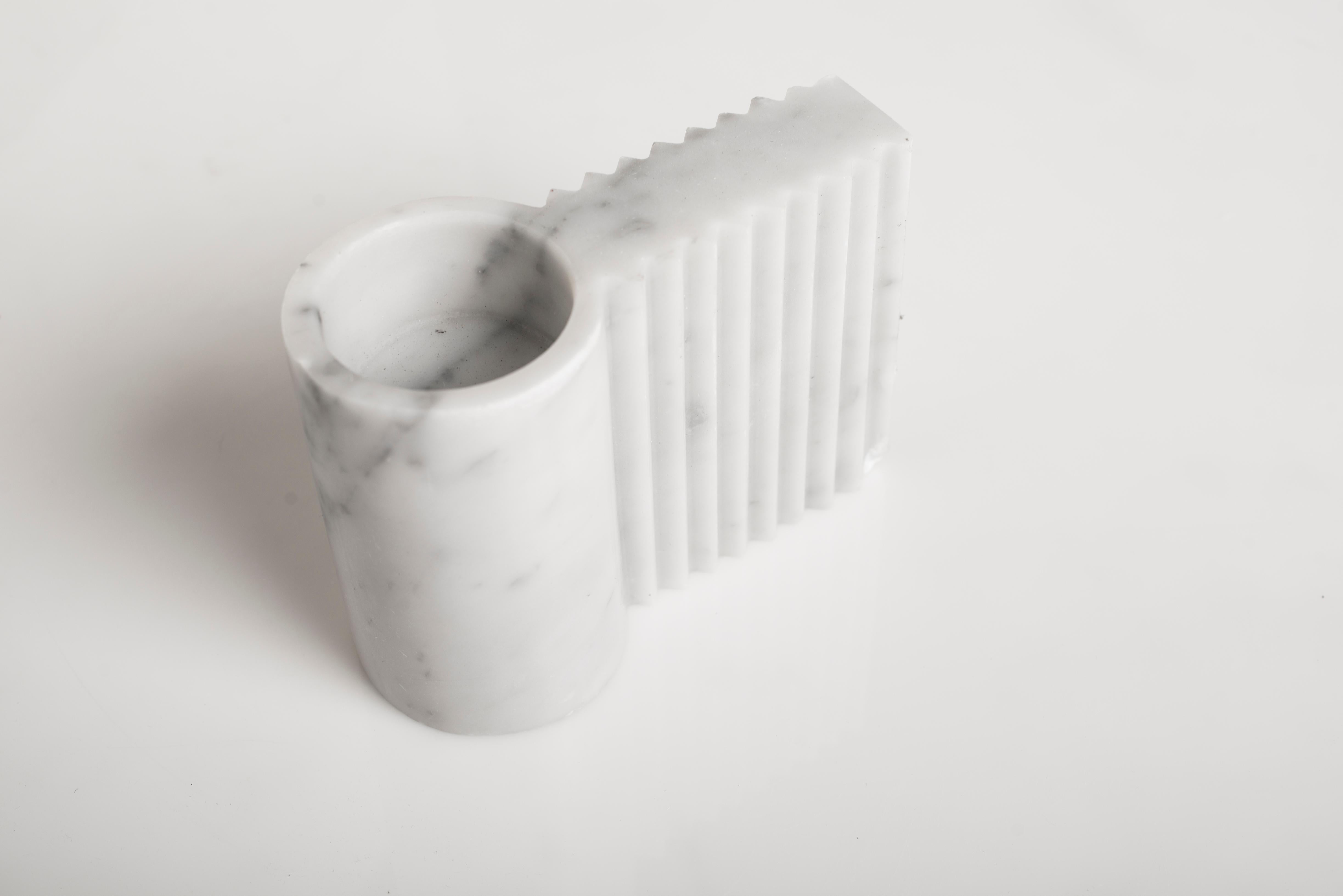 Kabul sculpture by Carlo Massoud
Handmade 
Dimensions: D 7 x W 15.6 x H 12 cm 
Materials: Carrara Marble

Carlo Massoud’s work stems from his relentless questioning of social, political, cultural, and environmental norms. He often pushes his