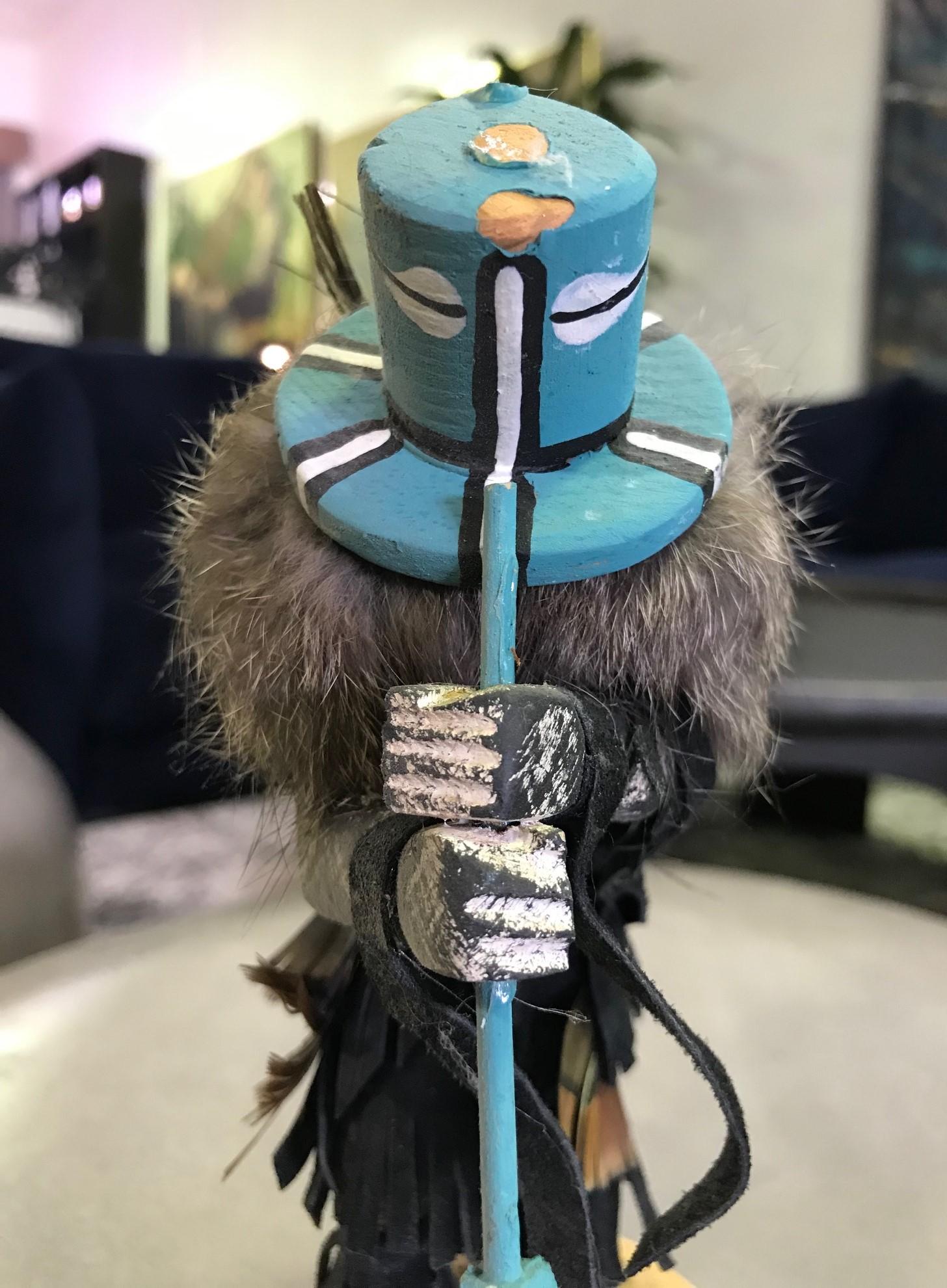 A wonderfully detailed and decorated Kachina doll.

Signed by the artist on the base.

From a collection of Native American objects and artifacts.

Dimensions: 7.75