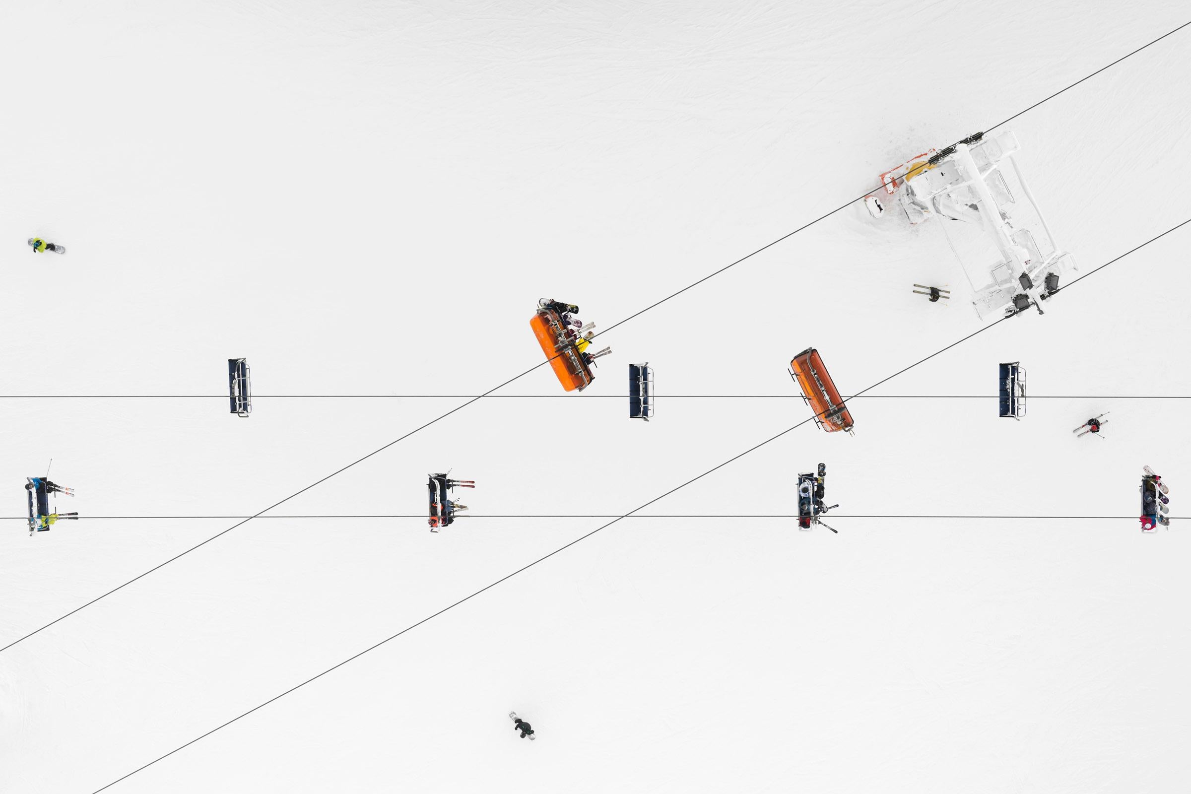 Kacper Kowalski Abstract Photograph - Side Effects, Depth of Winter, Skiers 01, abstract aerial landscape photograph