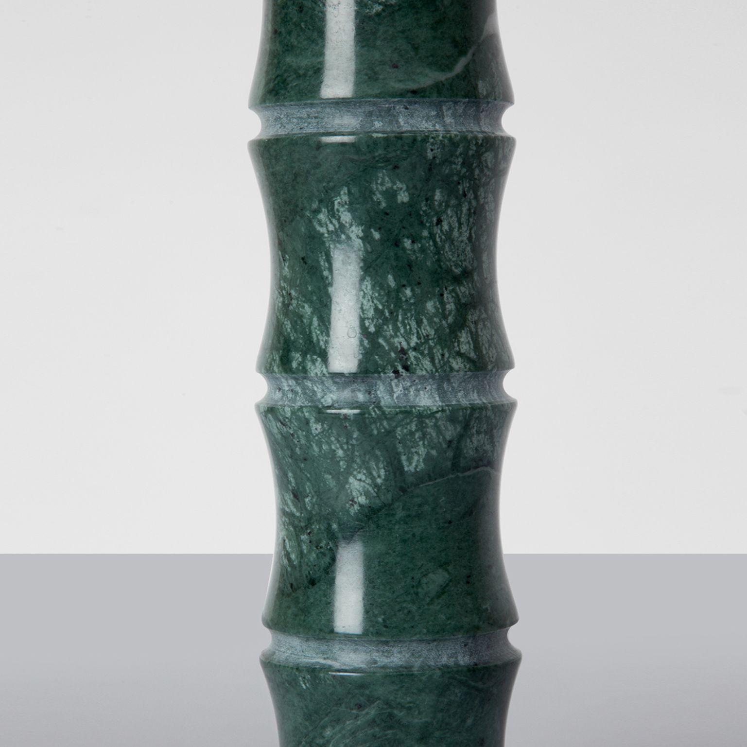 Kadomatsu candle holder large by Michele Chiossi
Jap Vegetation Collection
Dimensions: 5 x 27 cm
Materials: Verde Guatemala

A zigzag line defines the illusory border between art and design. Chiossi crosses it entirely by creating a collection