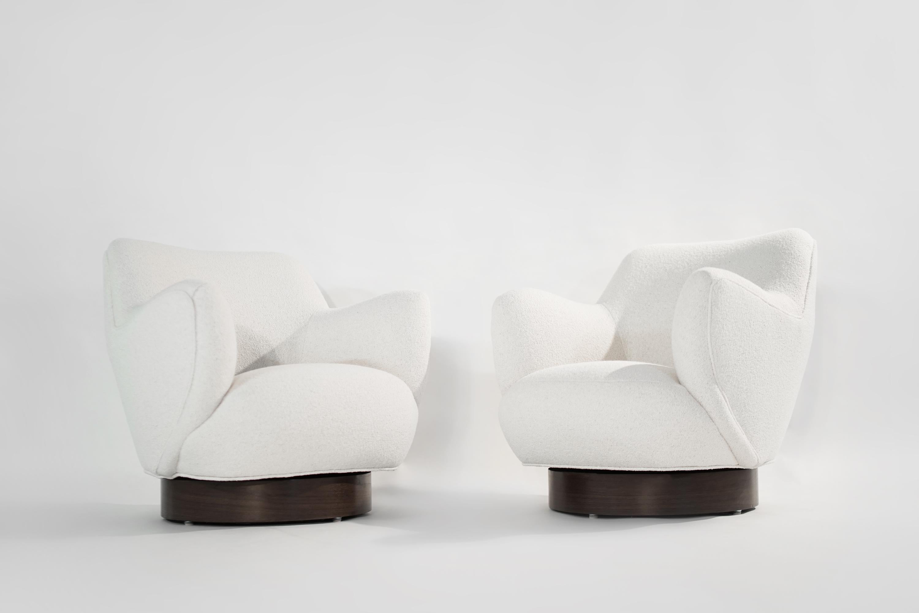 Rare set of swivel chairs designed by Vladimir Kagan for Kagan-Dreyfuss. Newly upholstered in Italian bouclé. Walnut bases fully restored. New swivel mechanisms. Priced as pair.

Other designers working in the organic style include Gio Ponti, Jean