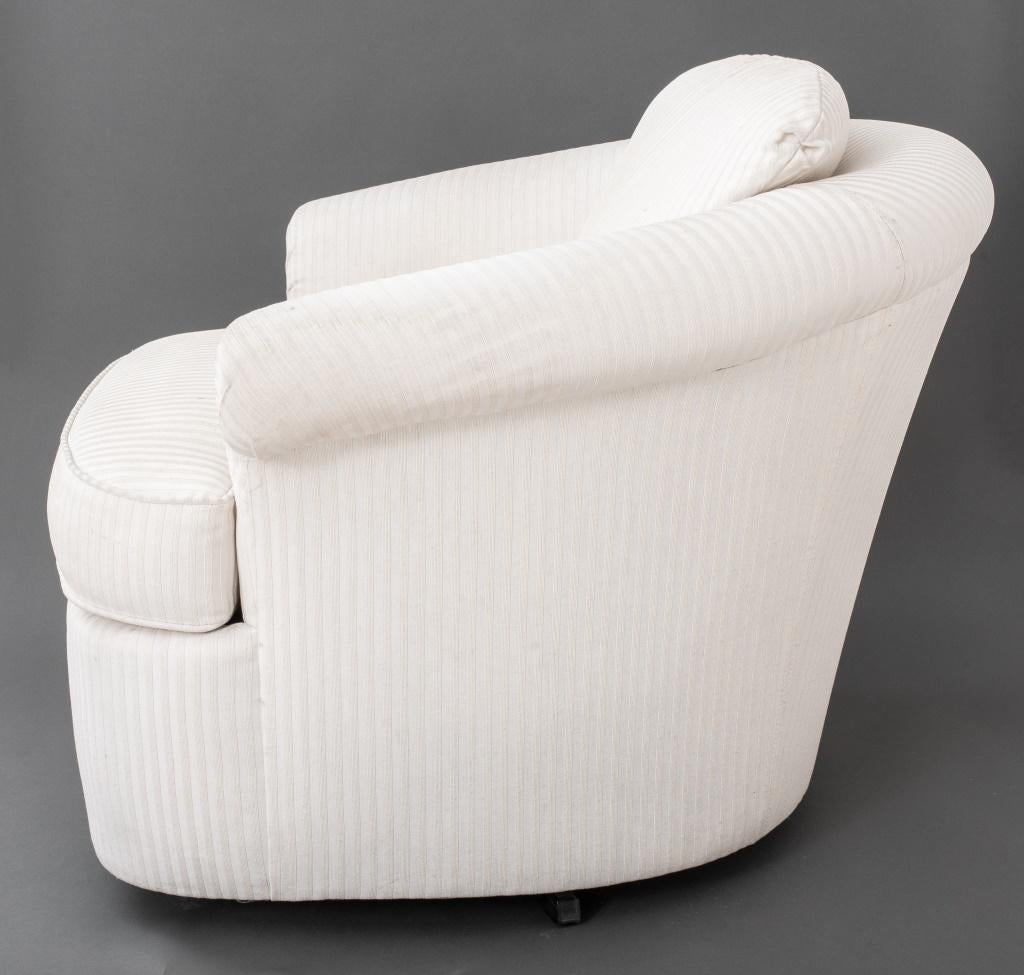 Modern Kagan Manner Cream Upholstered Swivel Armchair