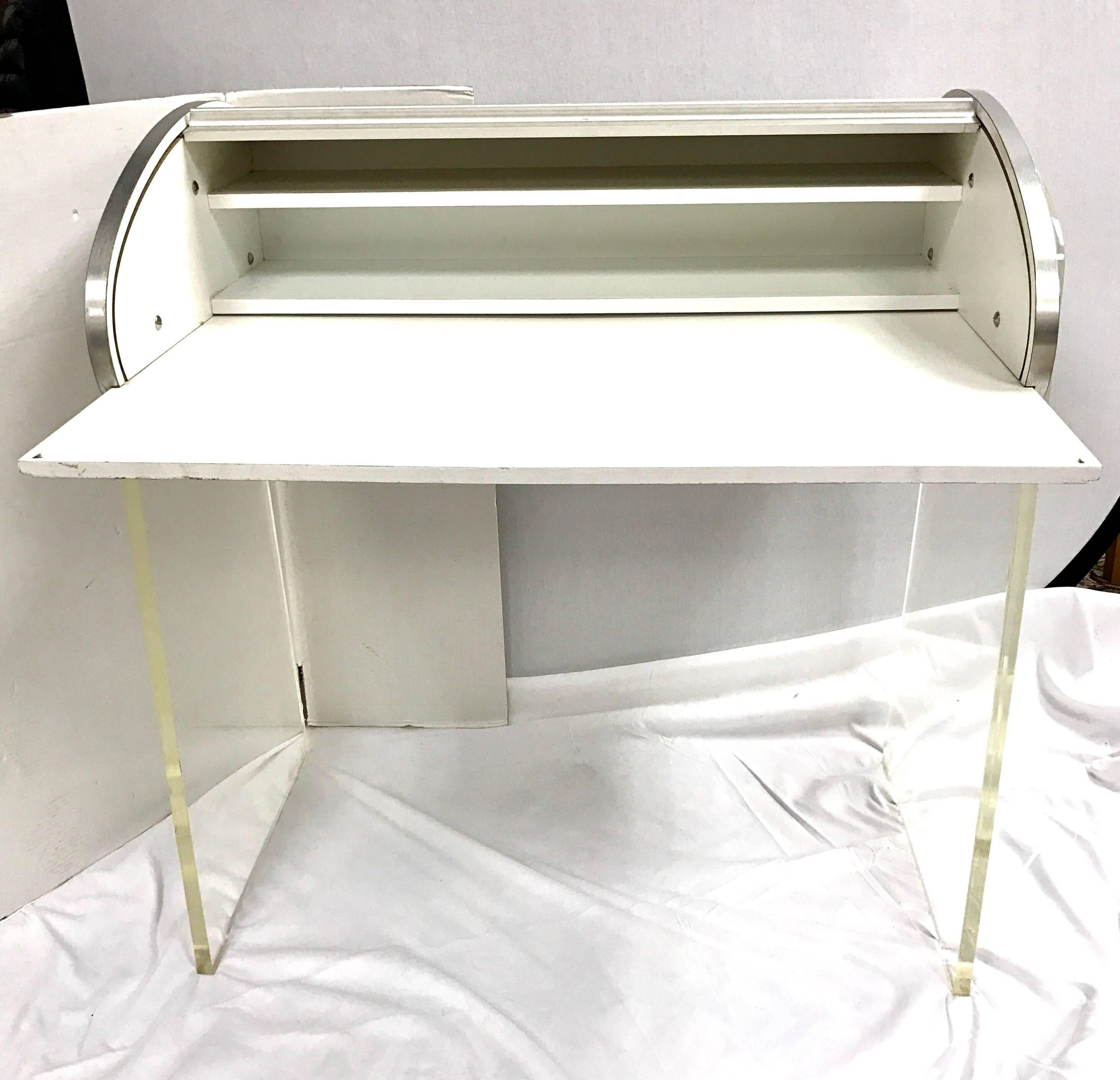 Midcentury aluminum roll top desk with a Lucite base. Writing area pulls out once top rolls open.
Writing surface pulls out to 31.5 W x 18 D.