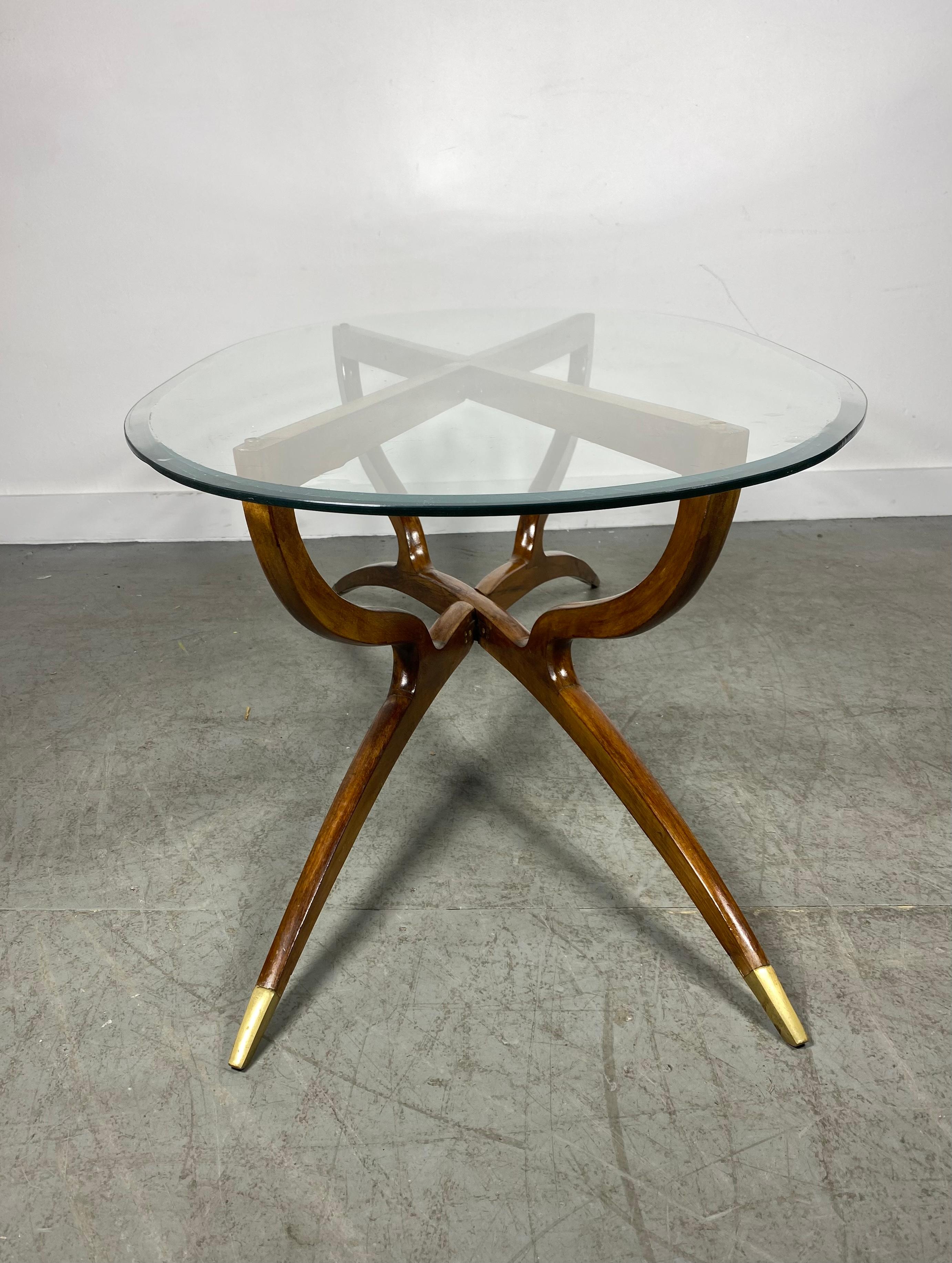 Stunning Mid-Century Modern Kagan Style Spider Leg Coffee/ Cocktail table, sculpted walnut. Beautiful beveled glass top, brass accents to feet (base).