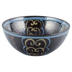 Kähler. Ceramic bowl. Polychrome glaze on a black base. Circa 1930s.