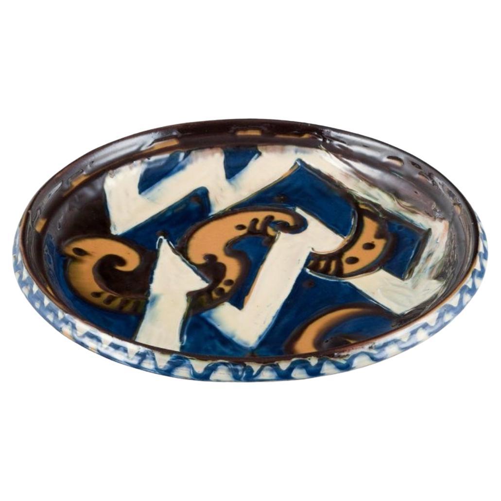 Kähler ceramic dish in cow horn technique. Abstract motif. Ca 1930s For Sale