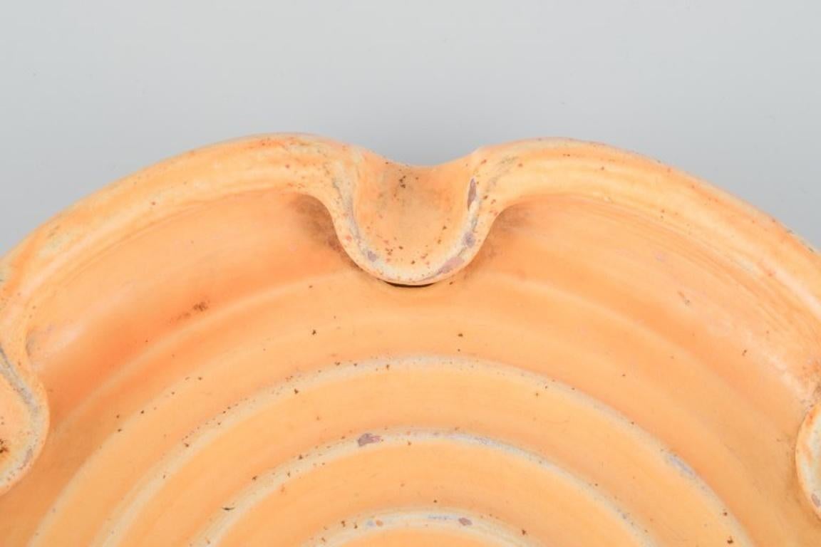 Glazed Kähler ceramic dish in uranium glaze. Spiral-shaped motif. Approx. 1930 For Sale