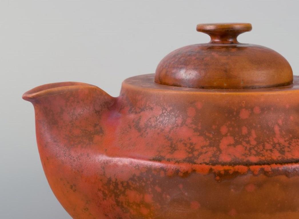 Glazed Kähler, ceramic teapot with uranium glaze. Mid-20th century.