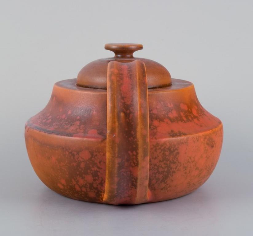 20th Century Kähler, ceramic teapot with uranium glaze. Mid-20th century.
