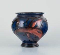Kähler ceramic vase in cow horn technique. Glaze in blue and orange tones.