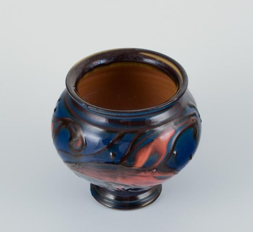 Scandinavian Modern Kähler ceramic vase in cow horn technique. Glaze in blue and orange tones. For Sale