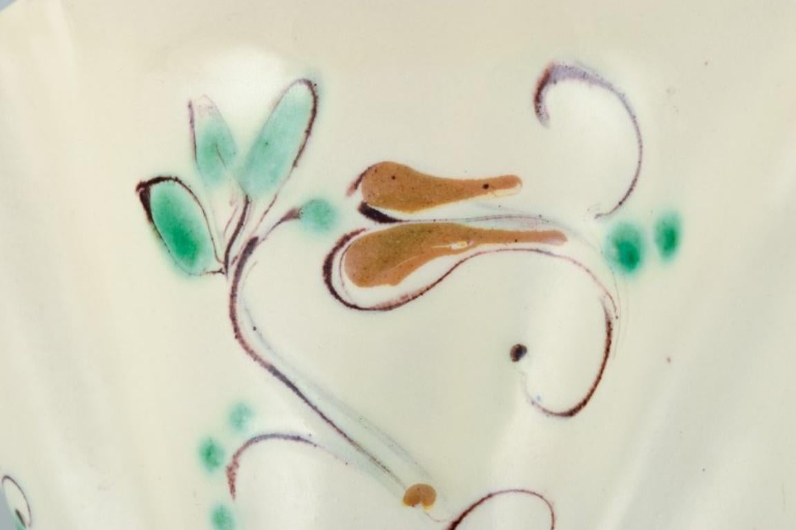 Danish Kähler. Ceramic wall-mounted plant holder. Glaze in light tones. Floral motif.  For Sale