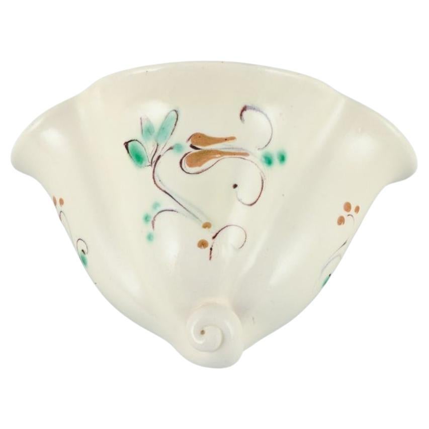 Kähler. Ceramic wall-mounted plant holder. Glaze in light tones. Floral motif.  For Sale