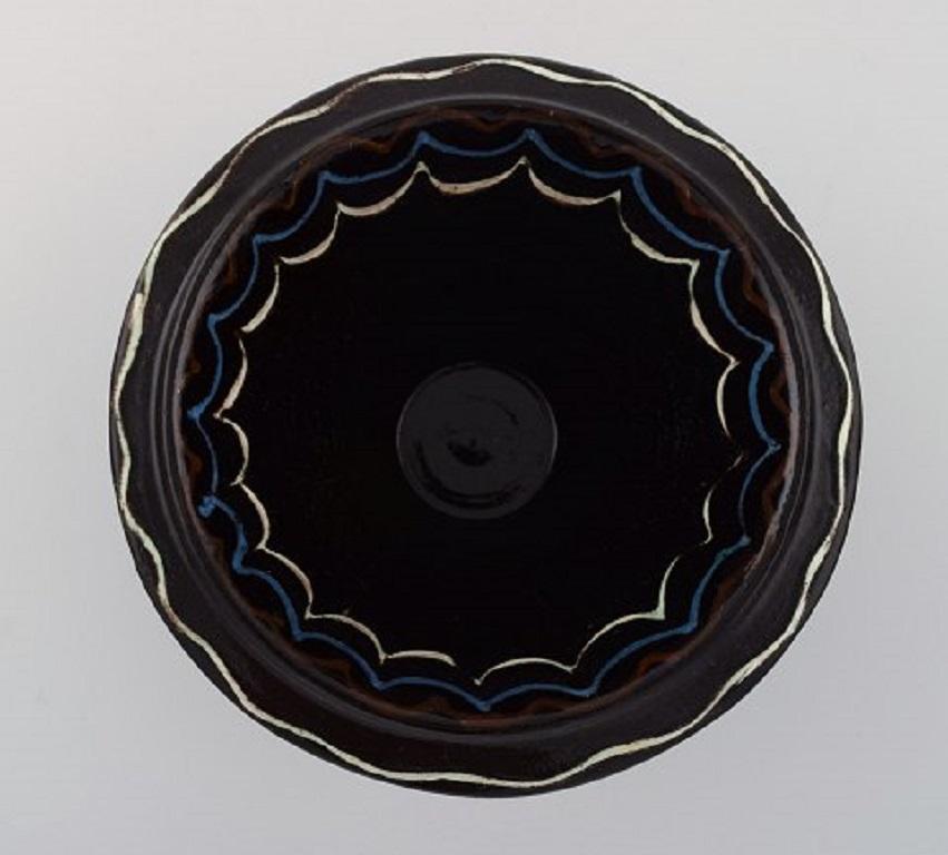 Folk Art Kähler, Denmark, Bowl in Black Glazed Ceramics with Blue and White Waves For Sale