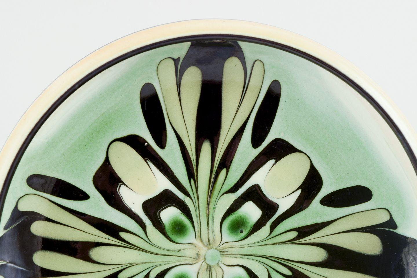 Glazed Kähler, Denmark. Ceramic bowl with floral motif. Glaze in green and black tones. For Sale