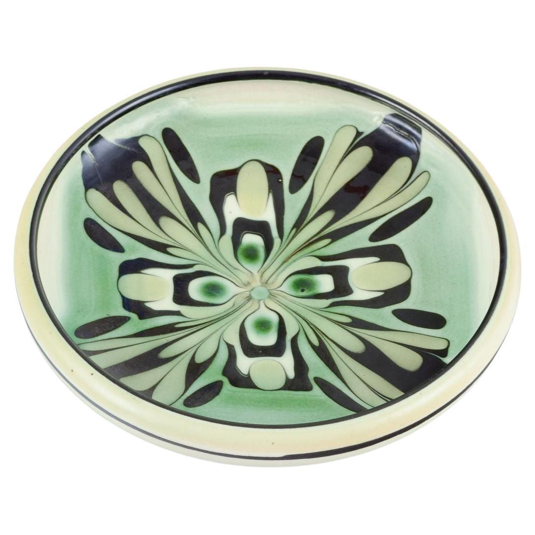 Kähler, Denmark. Ceramic bowl with floral motif. Glaze in green and black tones. For Sale