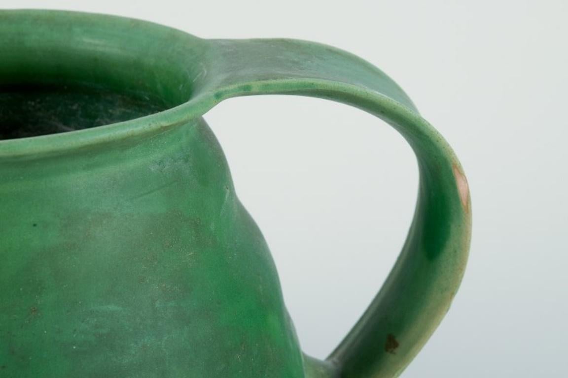 Mid-20th Century Kähler, Denmark. Ceramic pitcher. Glaze in green tones. Approx. 1930/40s. For Sale