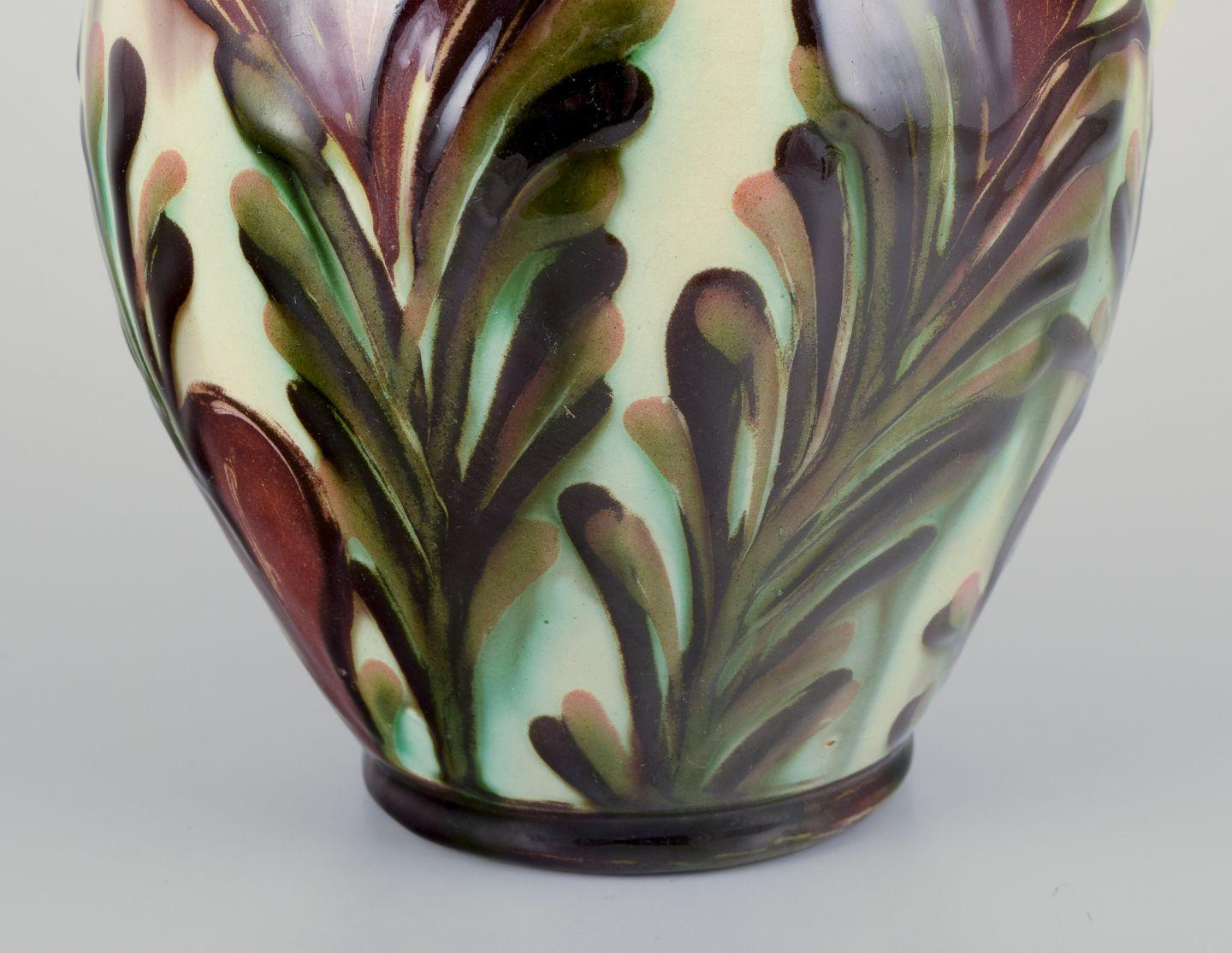 Danish Kähler, Denmark. Chocolate jug made of ceramic decorated with polychrome glaze. For Sale